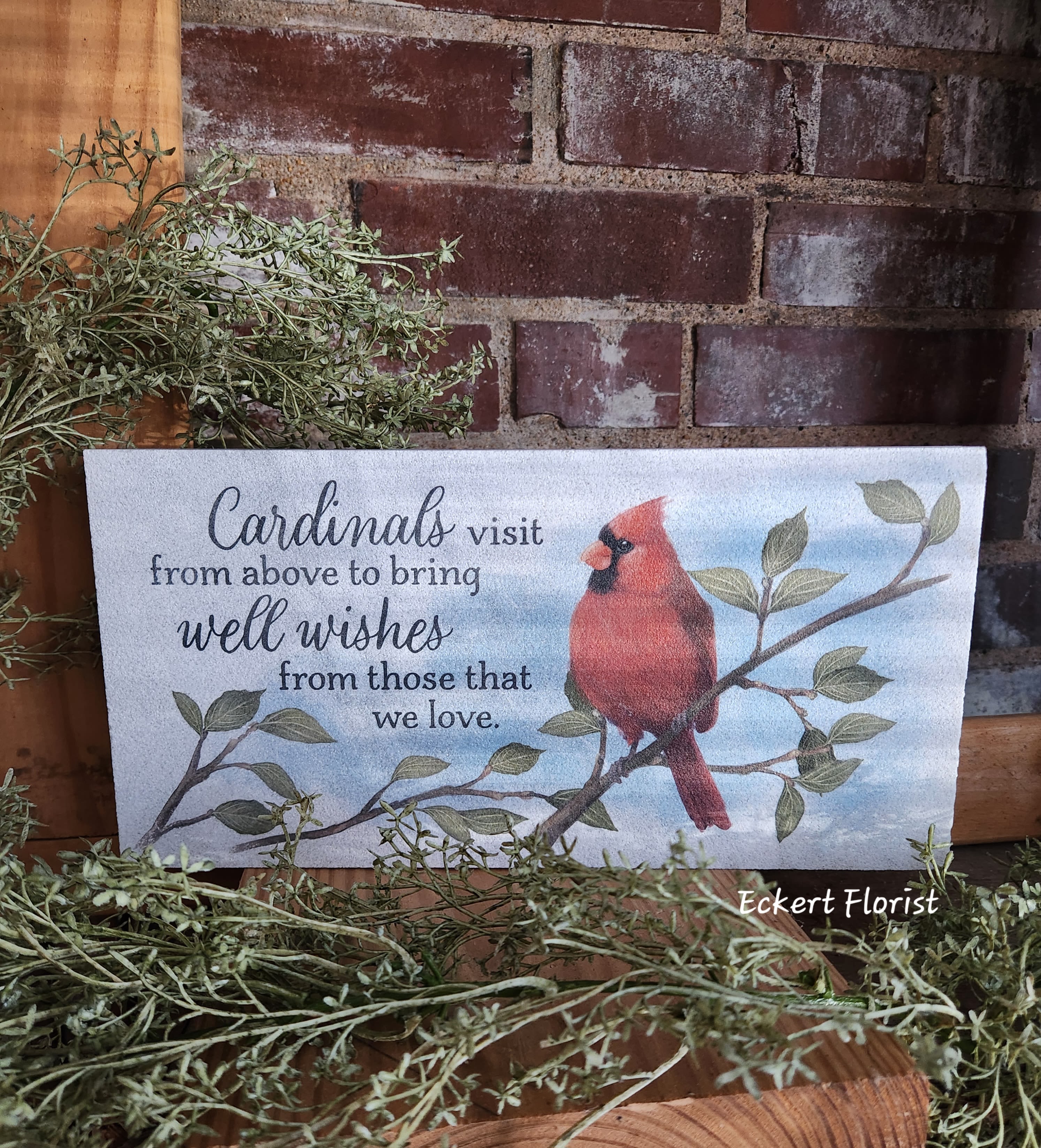 Eckert Florist's Cardinal Visit Marble Paver Memorial Stone *Our Local Delivery Only Eckert Florist's Cardinal Visit Marble Paver Memorial Stone *Our Local Delivery Only - This fine Turkish Marble weather friendly stone will make a perfect memorial gift. Sentiment on stone: "Cardinals visit from above to bring Well Wishes from those that we love." Designed and printed in the USA, this stone measures 6" H x 12" W x 1" *Our Local Delivery only