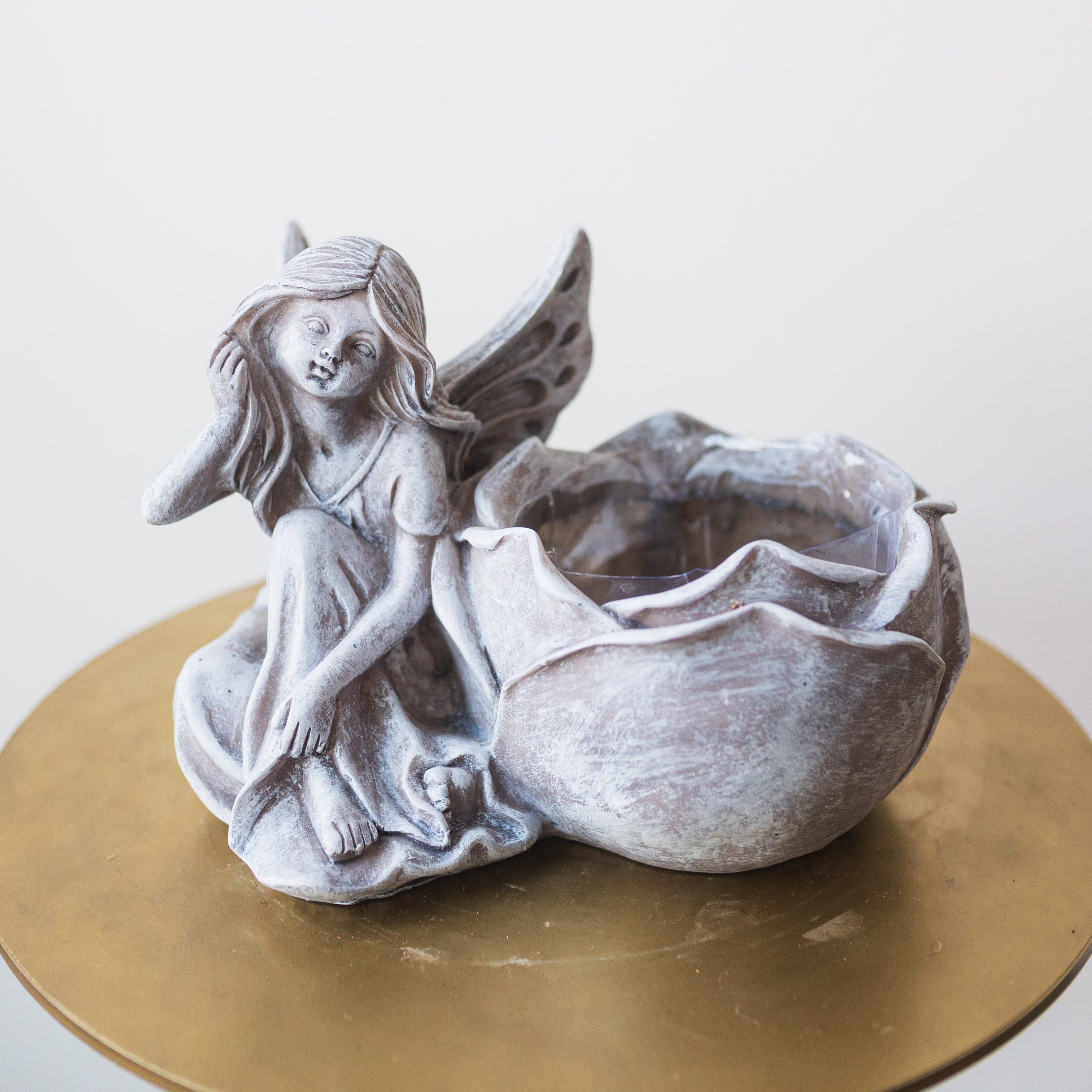 Stone Fairy Plant Holder Stone Fairy Plant Holder - A stone plant holder with attached fairyl. Pot is for a 4" plant.