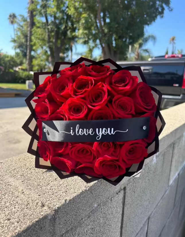 25 Red Roses "I Love You" Bouquet 25 Red Roses "I Love You" Bouquet - Express your deepest emotions with our exquisite 25 Red Roses "I Love You" Bouquet. This stunning arrangement features 25 hand-picked, velvety red roses, symbolizing passionate love and devotion. Each bloom is carefully arranged and accented with lush greenery to create a timeless declaration of your feelings. Perfect for anniversaries, special occasions, or simply to say "I love you," this bouquet is a classic gesture of romance that will leave your loved one speechless. Beautifully wrapped and delivered fresh to their door, it's a gift that speaks from the heart.