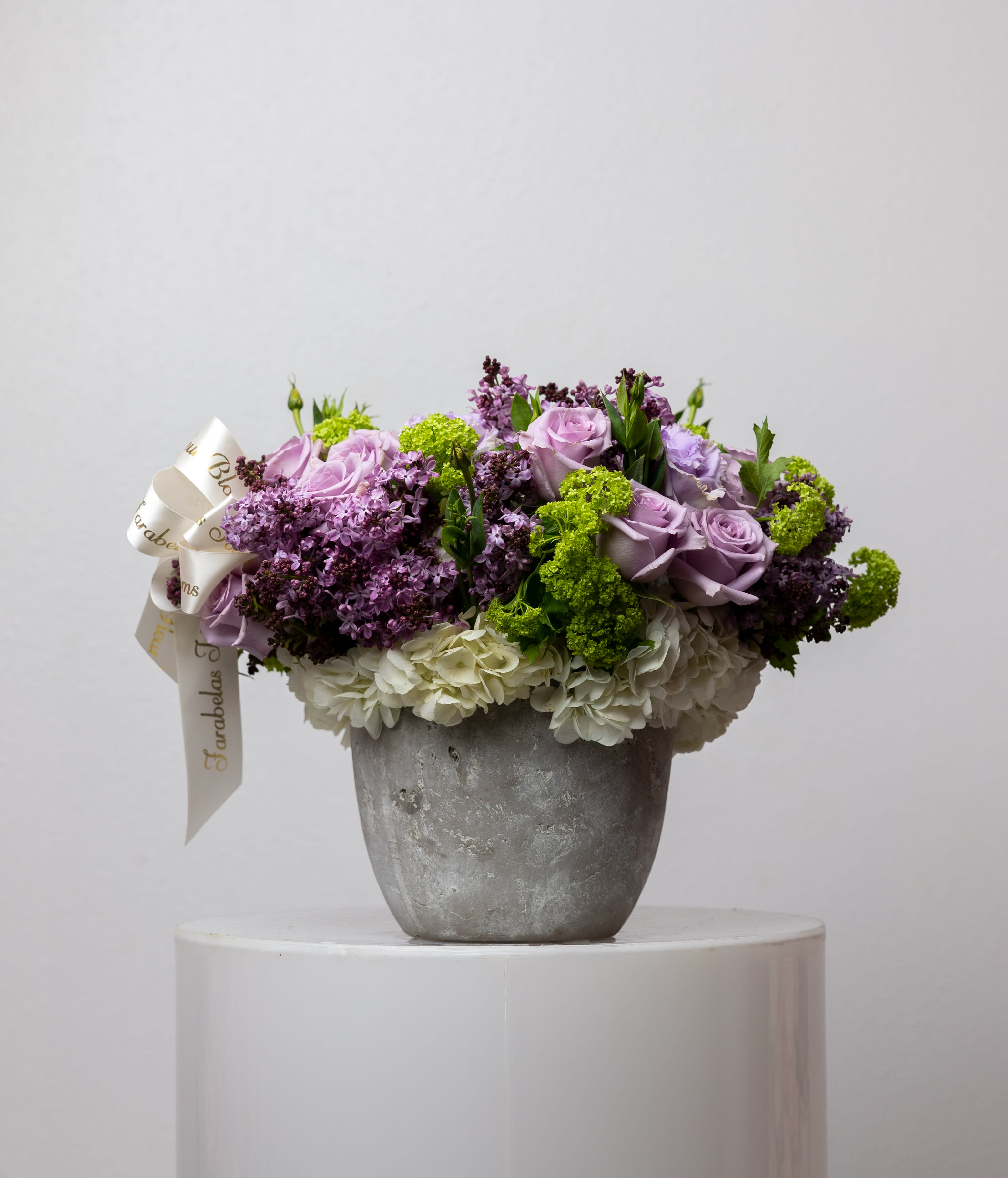 Lavanda - This arrangement comes with a mix of lime, green and lavender lilac mix blooms