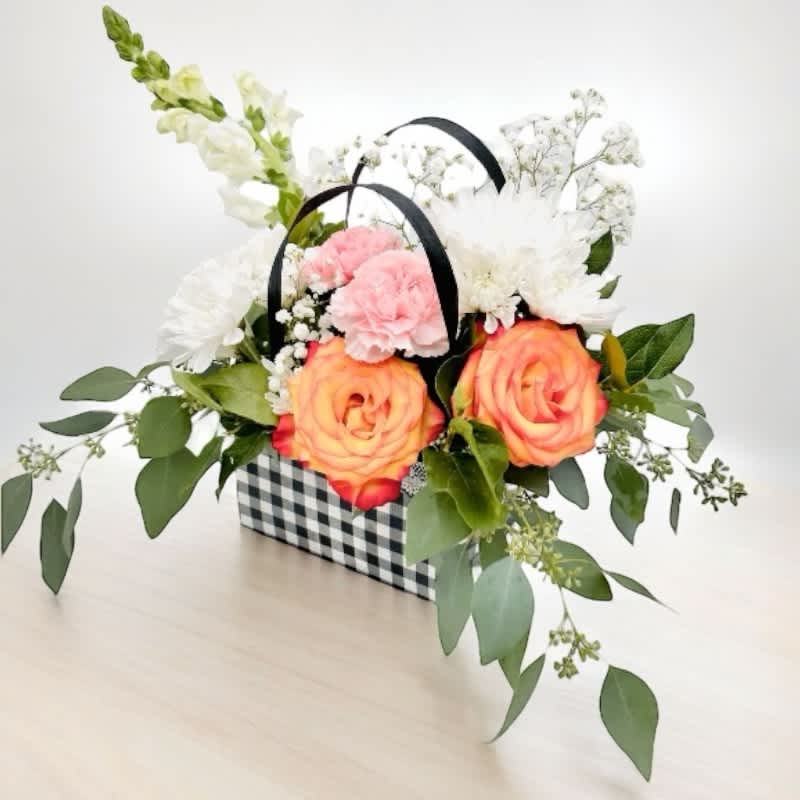 Hathor's Eternal Elegance #22 - Celebrate the essence of love, music, and beauty with &quot;Hathor's Eternal Elegance.&quot; This exquisite bouquet features: Vibrant orange-red roses symbolizing eternal love Pristine white poms for timeless purity Graceful white snapdragons representing inner strength Warm peach carnations for lasting charm Delicate gypsophila (baby's breath) for a touch of elegance  Inspired by the ancient Egyptian goddess Hathor, this arrangement is a perfect expression of deep emotions and timeless beauty, making it an ideal gift for any occasion. 