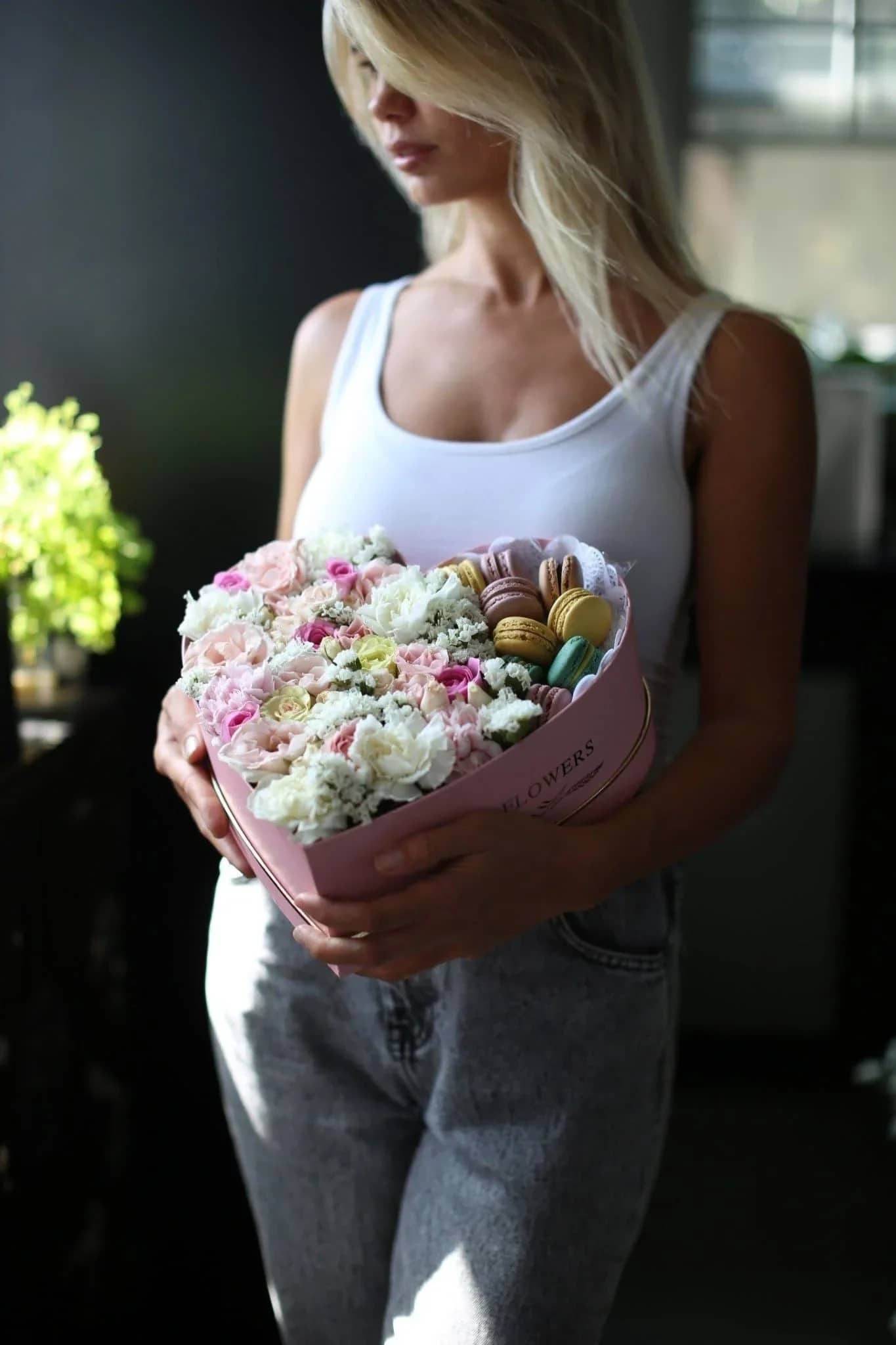 Freya - Freya is a mix of charming seasonal flowers are put together with 8 macaroons into a heart shaped box (pink /black /white).  It's the best floral composition for any occasion. For any floral or color preference add a note to the order. 