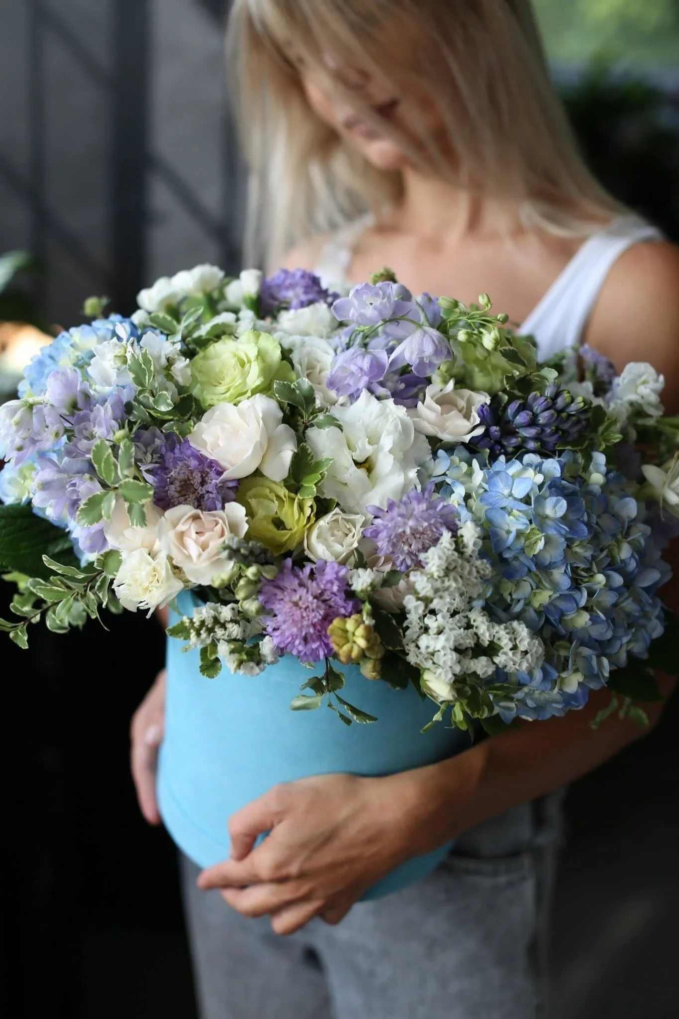 Lia - Lia is a stunning arrangement that includes hydrangeas, lisianthus, carnations, roses and mix of other flowers. They are blue, purple, white, pink and greenery. It's great for any occasions and events.