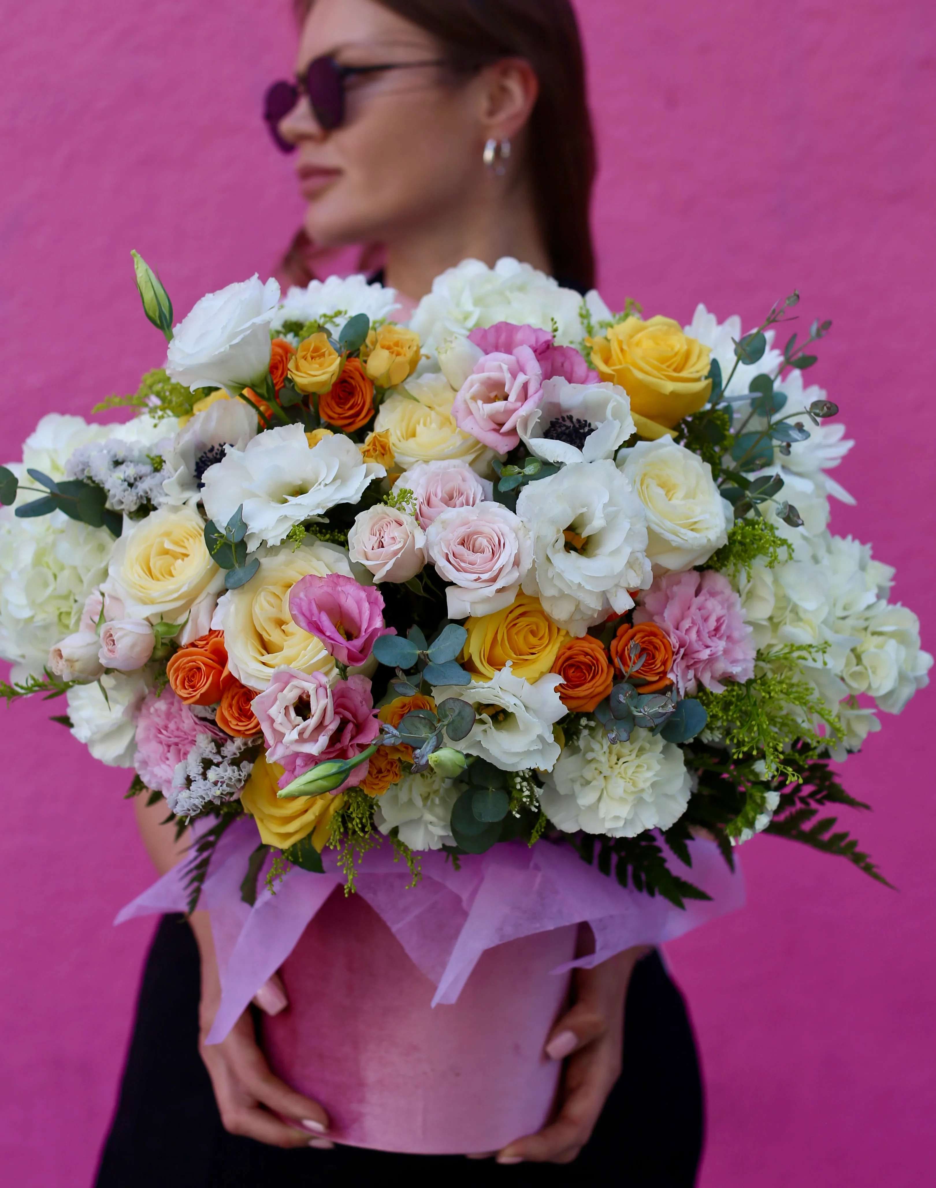 April - April features fresh yellow and orange roses, lisianthus, carnations, and eucalyptus in a velvet box, making it a perfect choice for Thanksgiving flowers or a Mother’s Day flower bouquet. 