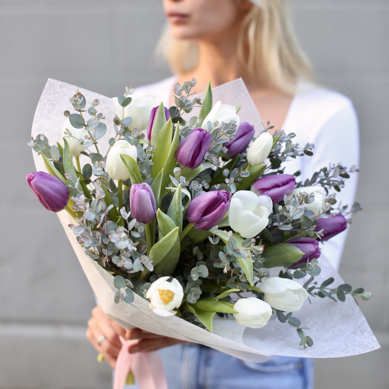 Hazel - Stunning composition of 30 mix color tulips with complimentary clear glass vase. Great gift to brighten up the day.