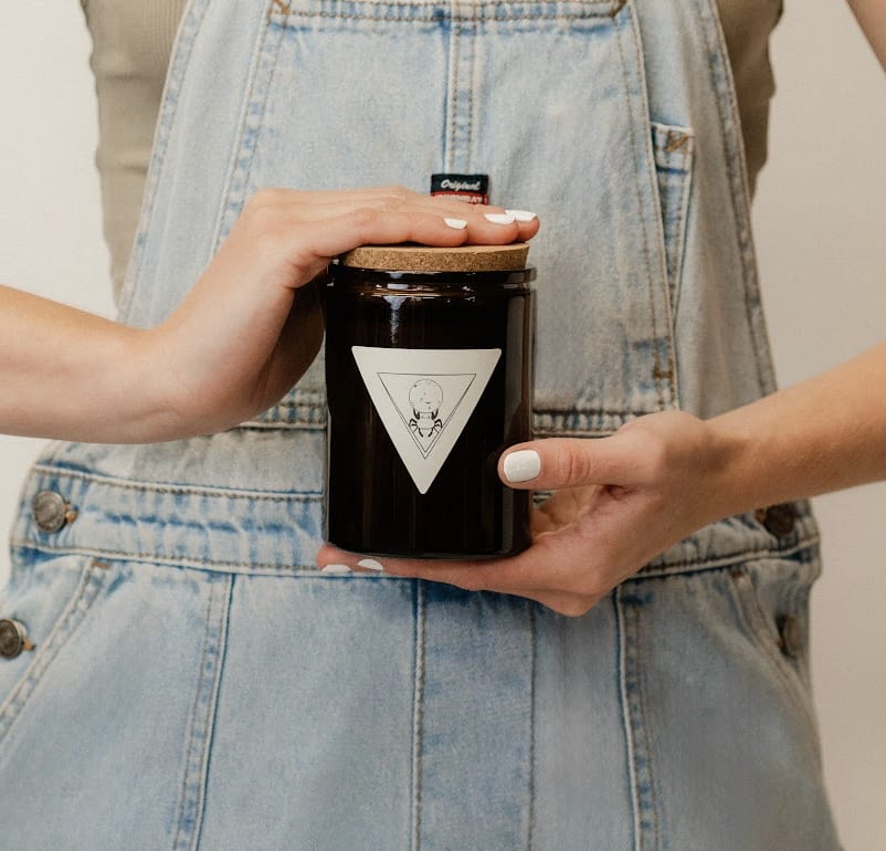 Locally Made Luxury Candle - Made locally by our favorite chandler, That Witch Apothecary! We will pick the best scent based on the season!   If you know what your person typically prefers scent-wise, leave us a note!  100 hour burn time. All soy wax. Amber hued glass with a cork lid. 