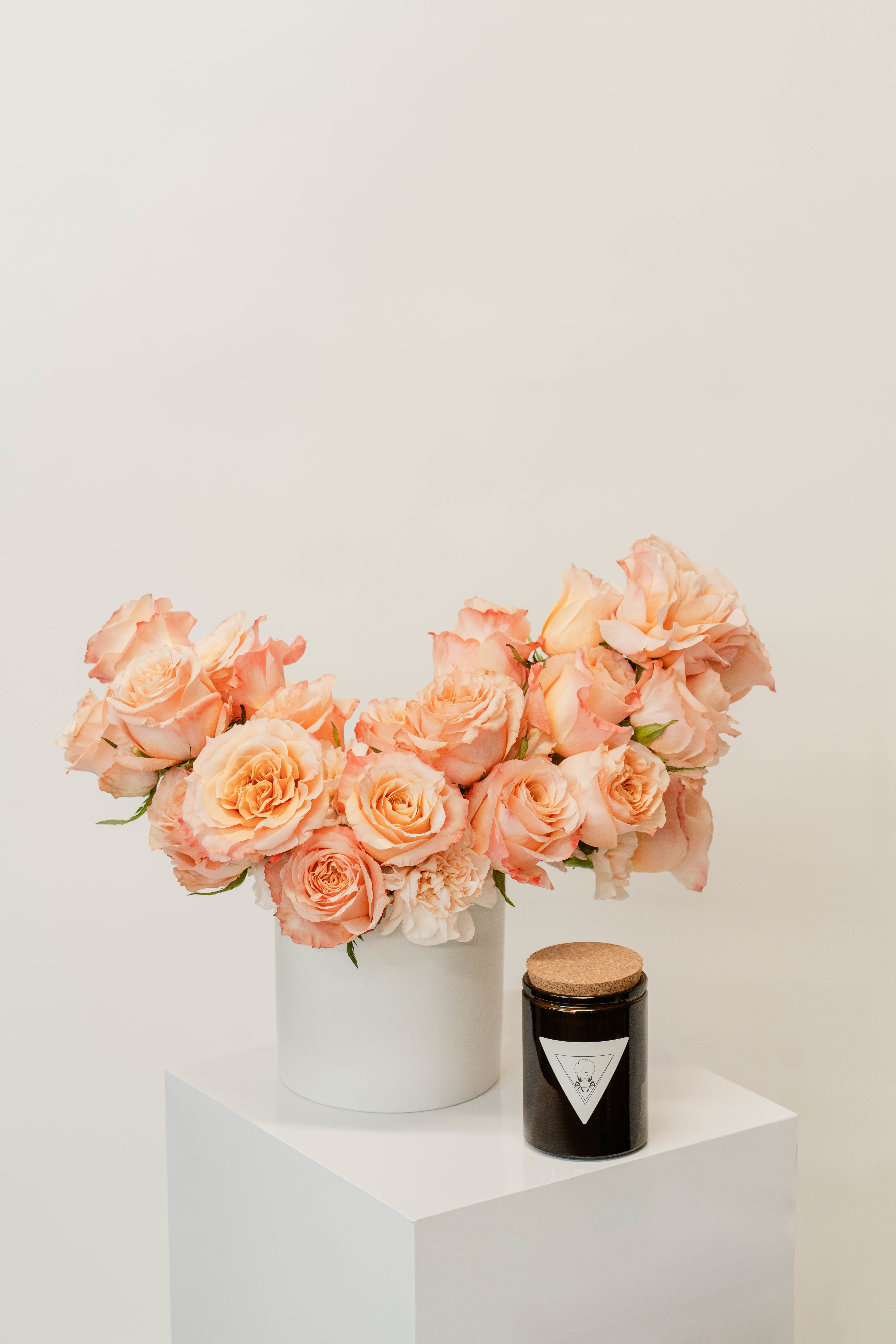 Two Dozen Roses + Candle Bundle - Our luxurious rose and candle bundle features two dozen premium roses paired with a handcrafted candle, offering a stunning display of beauty and sophistication. Perfect for making a grand romantic gesture or gifting with exceptional elegance, this bundle creates an unforgettable impression with its timeless charm and inviting glow.    