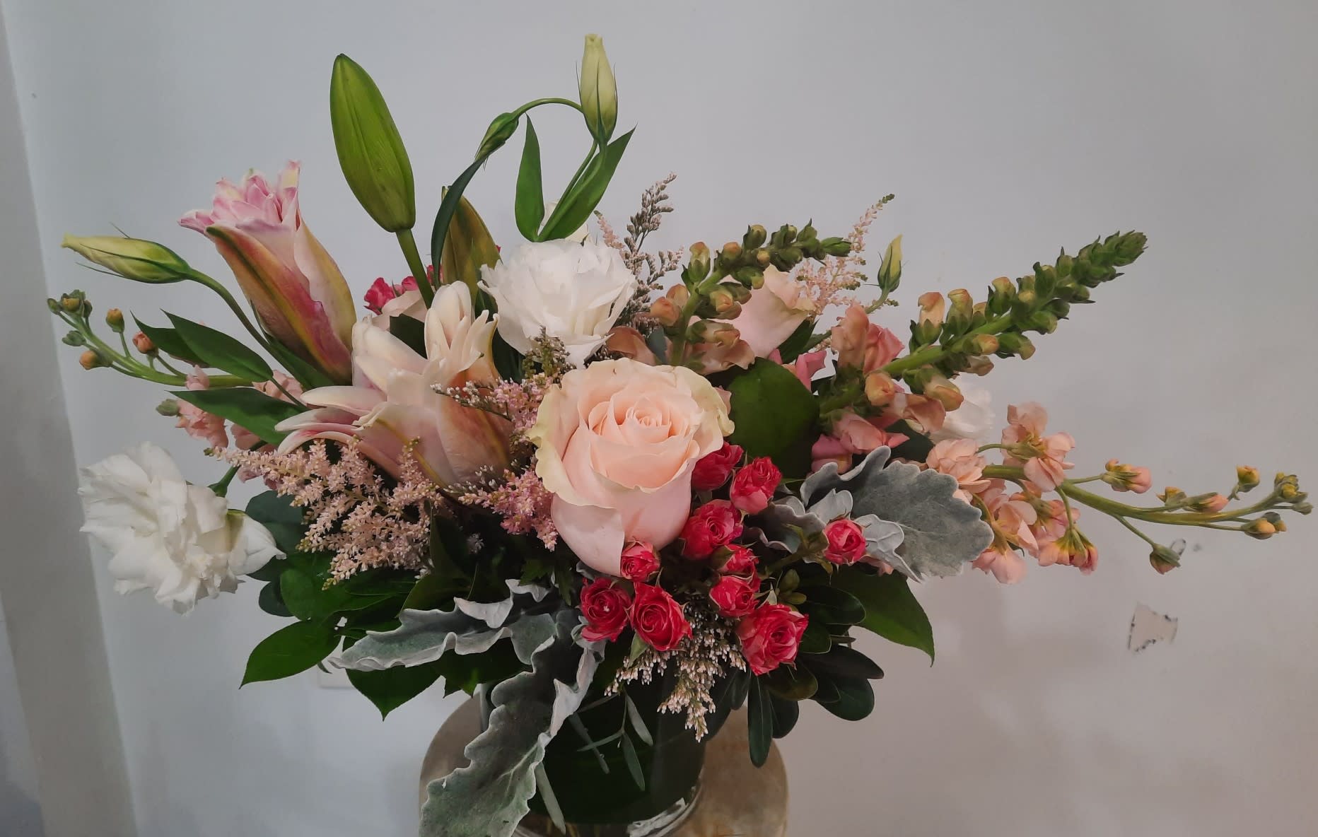 Hello Baby Girl! - Stock, rose lilies, lisianthus, roses, snapdragons, delicately designed to make the perfect arrangement for a new baby girl or any occasion!