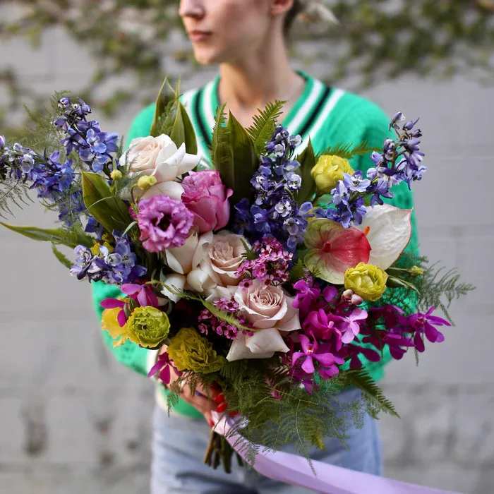 Melody - The bouquet with anthurium is the most beautiful and stunning flower arrangement consisting of delphinium, anthurium, roses, greenery, and other flowers. It comes in clear vase and it’s perfect for any occasion!
