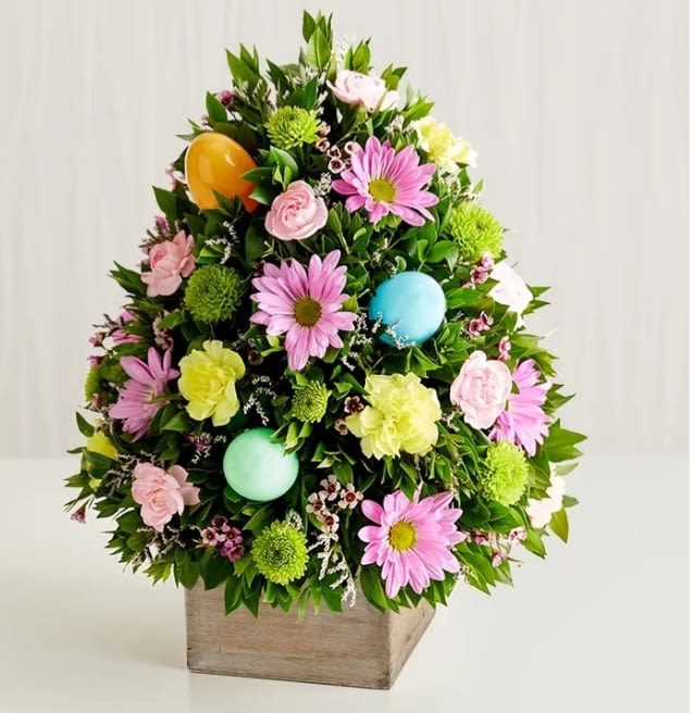 EASTER TREE - Beautiful Easter tree with a composition of daisies and carnations with bright colors that characterize this season, and beautiful Easter eggs, perfect for any event or to brighten the day of your loved one.