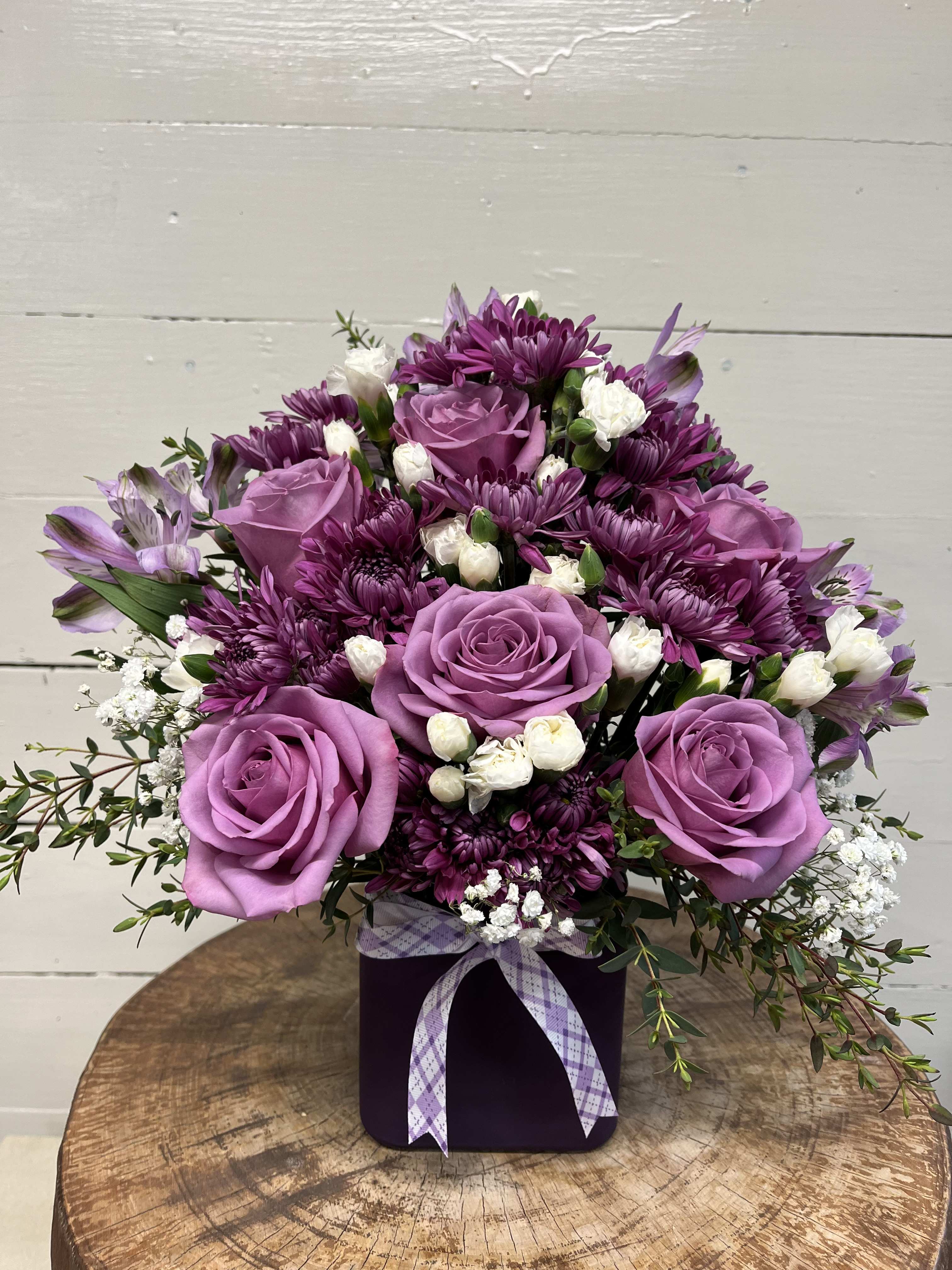Perfectly Purple - This monochromatic purple arrangement is perfect for any event ranging from a get well to a housewarming gift to a friend to a birthday surprise!   Approximate Dimensions: 10&quot;D x 10&quot;H