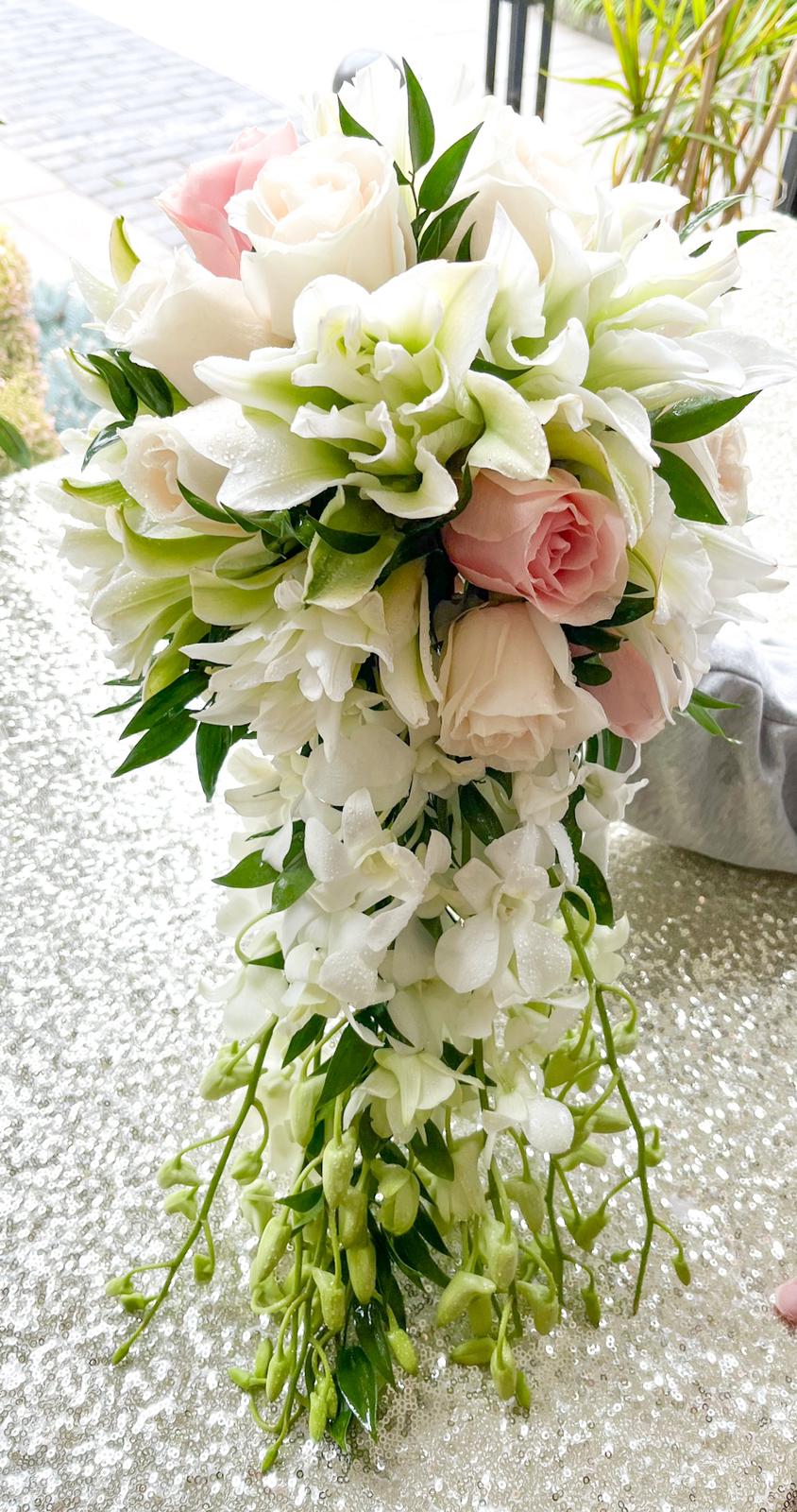 Bright Cascading Bouquet Bright Cascading Bouquet - Roses, lilies, and dendrobium orchids