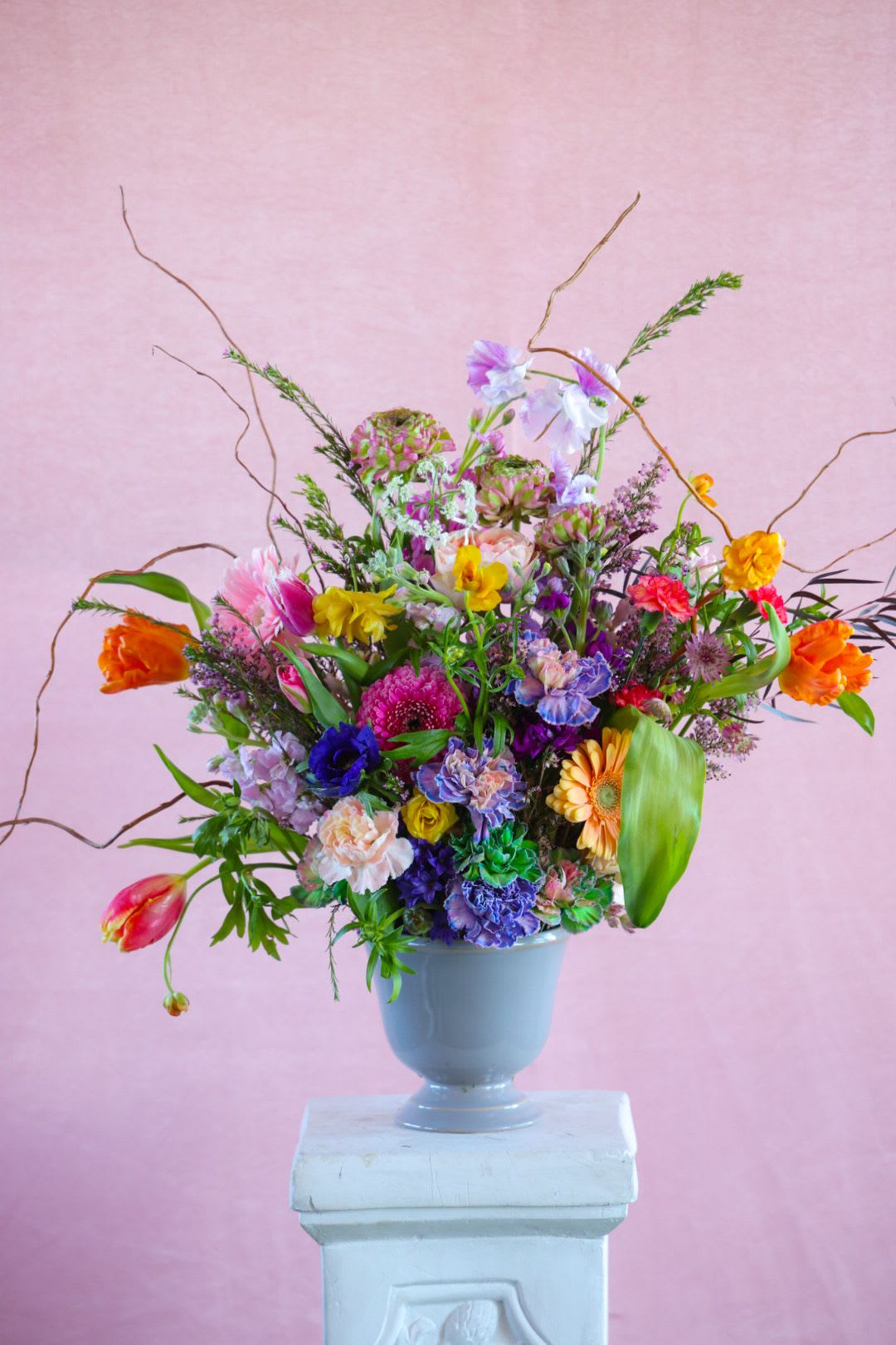 Spring Dreams Arrangement - The Spring Dreams Arrangement is pure playful color, and exuberant excitement that can only be asssociated with the anticipation for spring. Make your dreams vivid, cheerful and bright with this darling arrangement. From bedside, to dining table, wherever you place this arrangement it is sure to lighten your heart and gladden your footsteps.  Please add your tip here!  Custom, one of a kind floral arrangements by floral artist Stacy Leafsong.  Arrangement shown is a premium.   Photos provide examples, and each arrangement &amp; vase is unique.  Arrangements will be delivered before 7pm, for specific delivery time please include in special instructions. On holidays, our busiest times, deliveries will be made by 7:30pm.