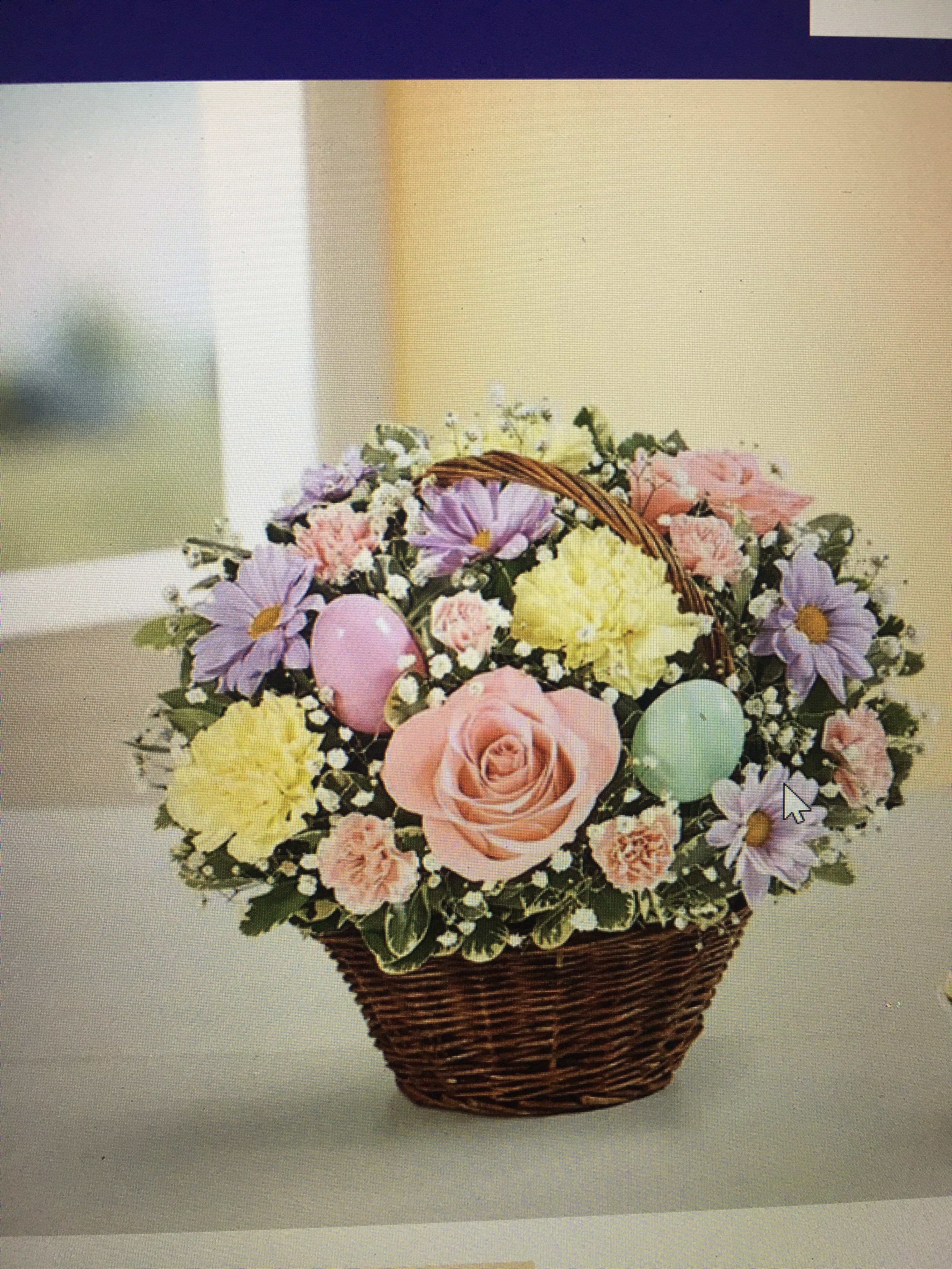 Easter egg basket  - Light pink minis and roses daisies and pomp’s arranged in a wicker basket with Easter eggs added