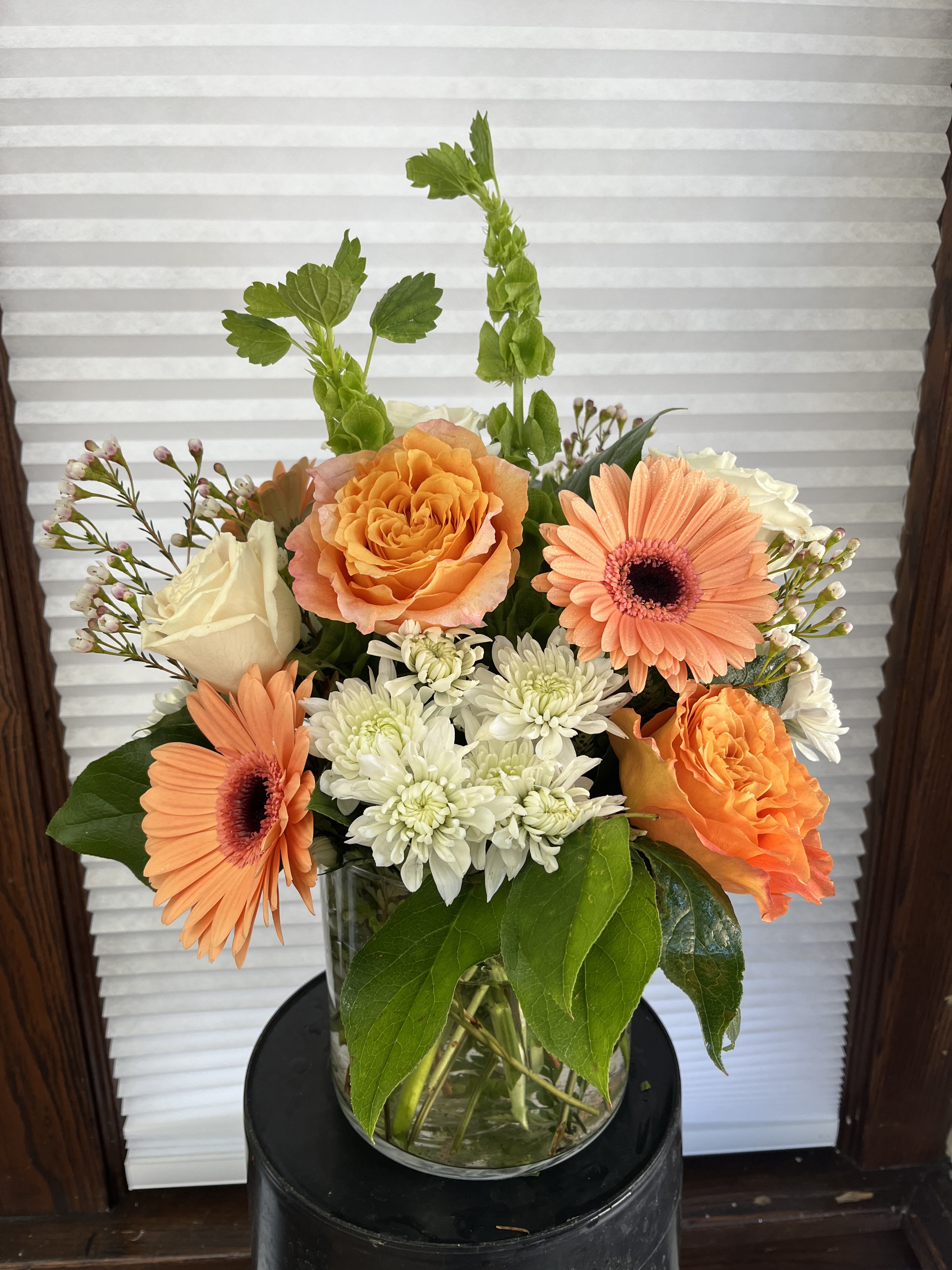 Just Peachy Just Peachy - If she's a real peach, she will love this arrangement! Gerbera daisies, bells of Ireland, garden roses and more!