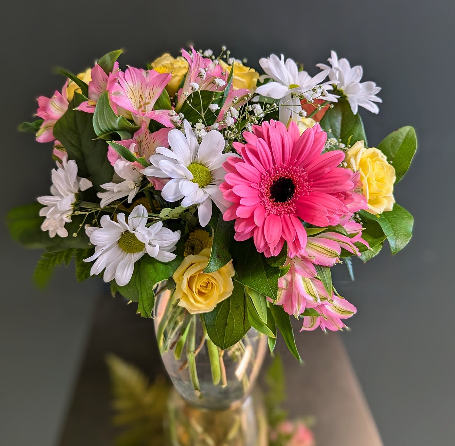 Cheer Your Day Bouquet Cheer Your Day Bouquet - Send this bouquet when you would like to send something that smells fresh and looks full and lasts a long time. This arrangement is great for a pick me up, Happy Birthday or just to say hello!