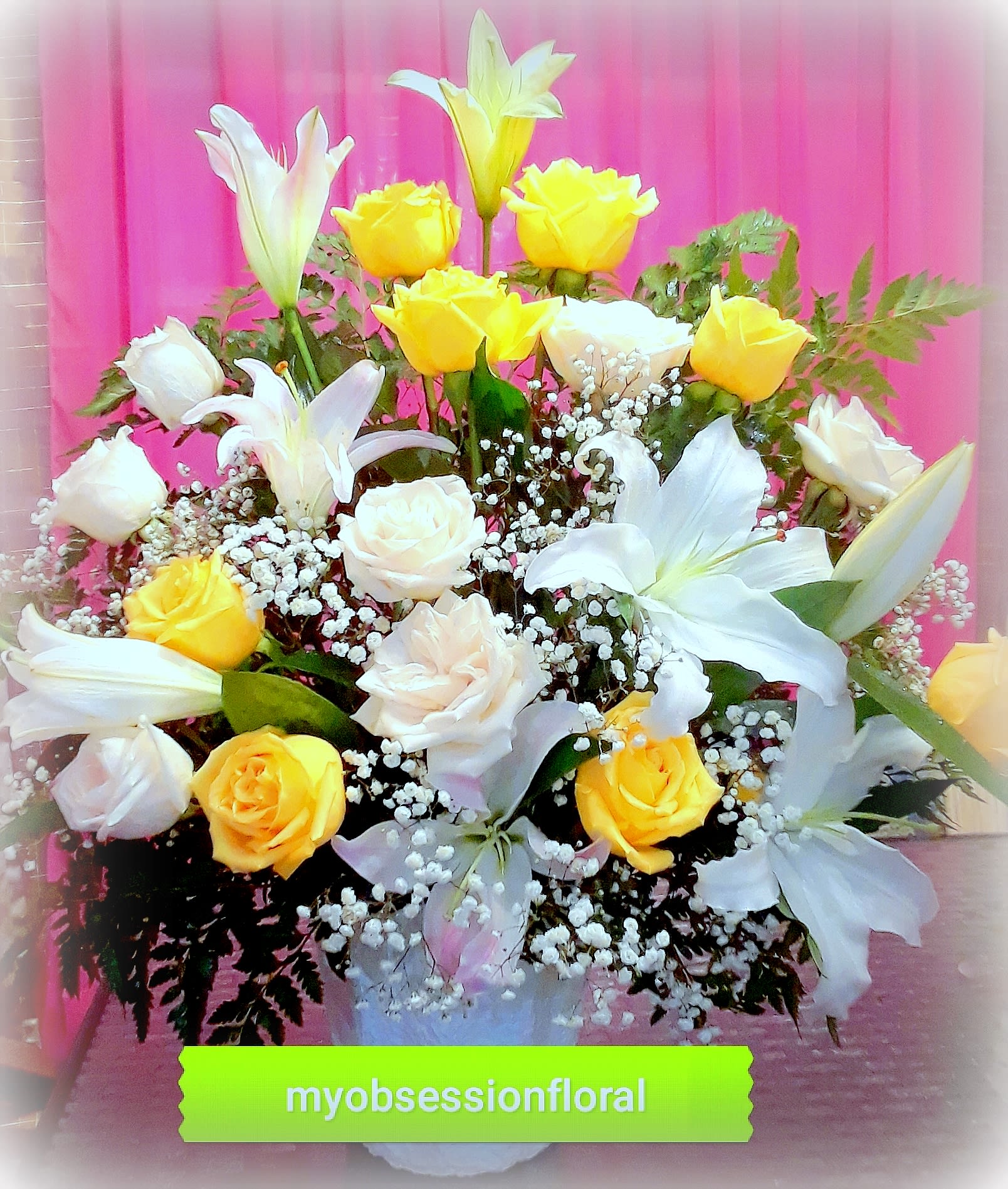 White and Yellow Light. - Fresh floral funeral basket arrangement of roses and lilies, in yellow and white.
