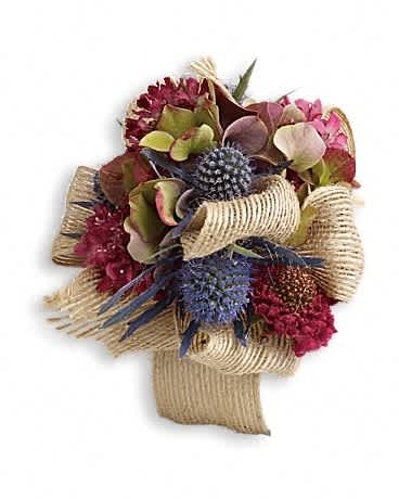Midnight Wanderings Corsage - Take your own path with this wild, wondrous blend of green hydrangea and blue eryngium. Green hydrangea, burgundy scabiosa and blue eryngium.Approximately 4&quot; W x 5&quot; H