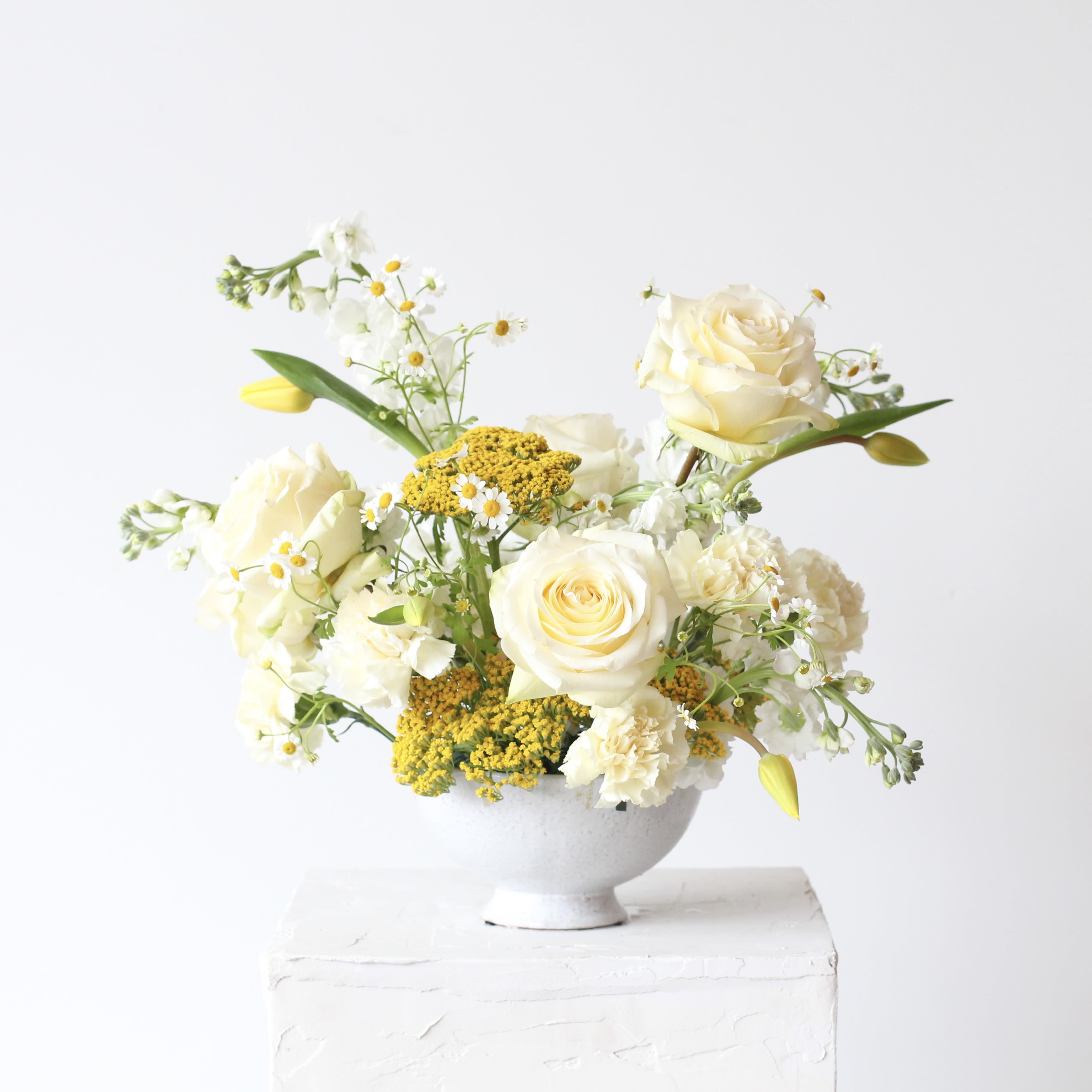 Yellow &amp; White Deluxe Centerpiece  - Elevate your celebration with the beauty of coordinated sophistication with Middlemist's A la Carte Events! This thoughtfully curated collection features products in harmonized color palettes. Select one to bring style and cohesion to your special occasion. With a minimum purchase of $300, create a polished look, knowing every piece complements the other perfectly.  Our deluxe centerpiece is ideal for tables seating eight or more guests, a larger welcome table, or as a standout eyepiece for your bar. It’s designed to add that extra pop of beauty and elegance to your special occasion.