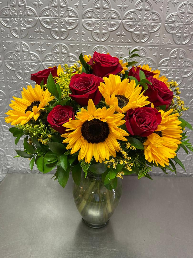 My Truly Sunshine by WOH - a combination of red roses and sunflowers other color roses by request on our instruction section.