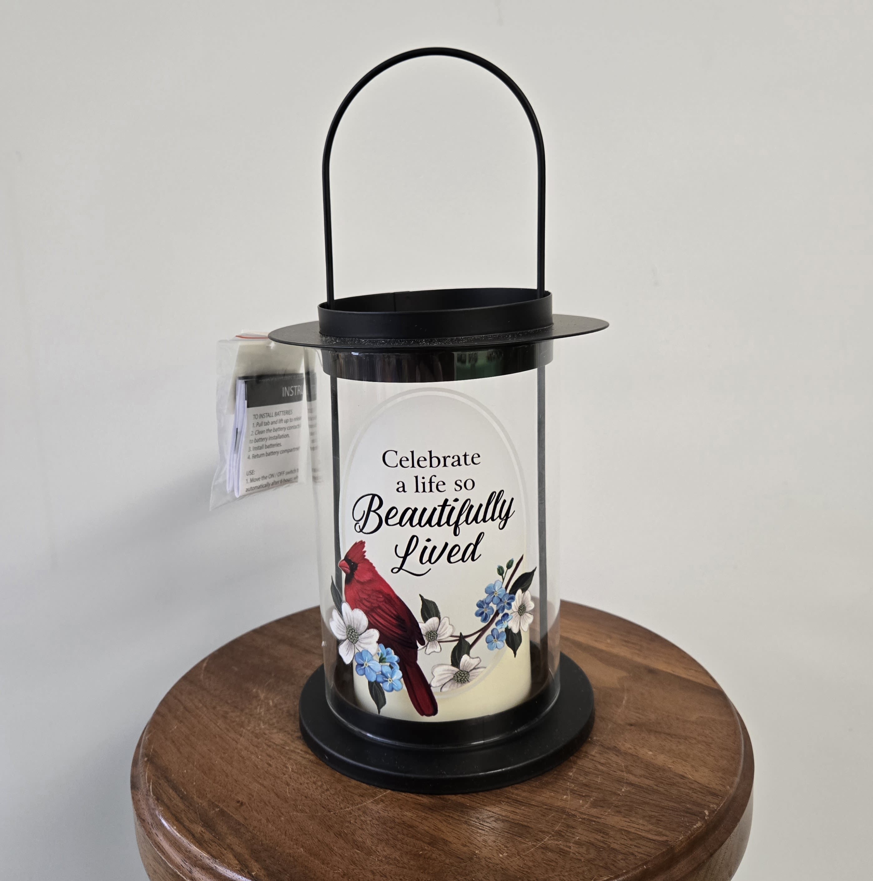 LED lantern - "Celebrate a life" LED lantern - "Celebrate a life" - Cylindrical lantern with red birds and an LED candle "Celebrate a life so beautifully lived"