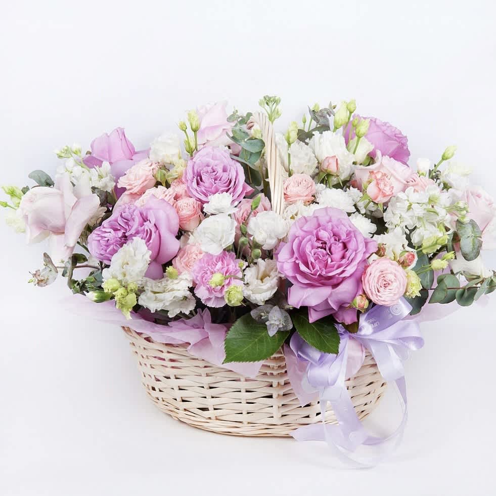Garden Harmony Basket - Delight in the beauty of our Garden Harmony Basket, a charming arrangement that brings together a vibrant assortment of blooms. Nestled in a rustic basket, this bouquet features a harmonious blend of roses, chrysanthemums, and seasonal flowers, each selected for their freshness and color. Perfect for any occasion, from birthdays to anniversaries, this floral arrangement radiates joy and warmth. Let this exquisite basket of flowers express your sentiments with elegance and style, creating lasting memories for your loved ones.