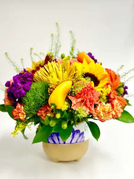 ! Viva Mexico ! Floral Arrangement - The Viva Mexico Floral arrangement is made colorful and folkloric style of Dia de los muertos ( Day of the Deads ) and some peppers for decoration made with sunflowers, carnations, dianthus, stock, mums. solidago, and gerbers on a hand painted ceramic vase.