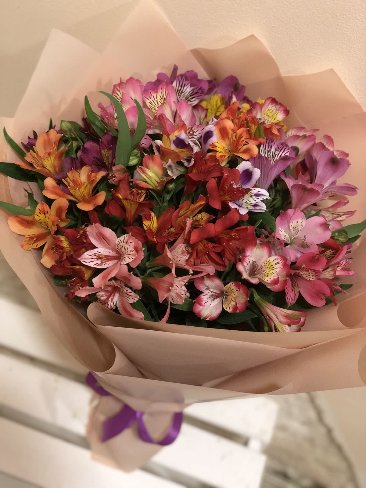 Alstroemeria Bouquet - A beautiful bouquet of 30 colorful alstroemeria stems, wrapped in paper that enhances their natural beauty. Their freshness and long-lasting charm make them the perfect choice for any special occasion.