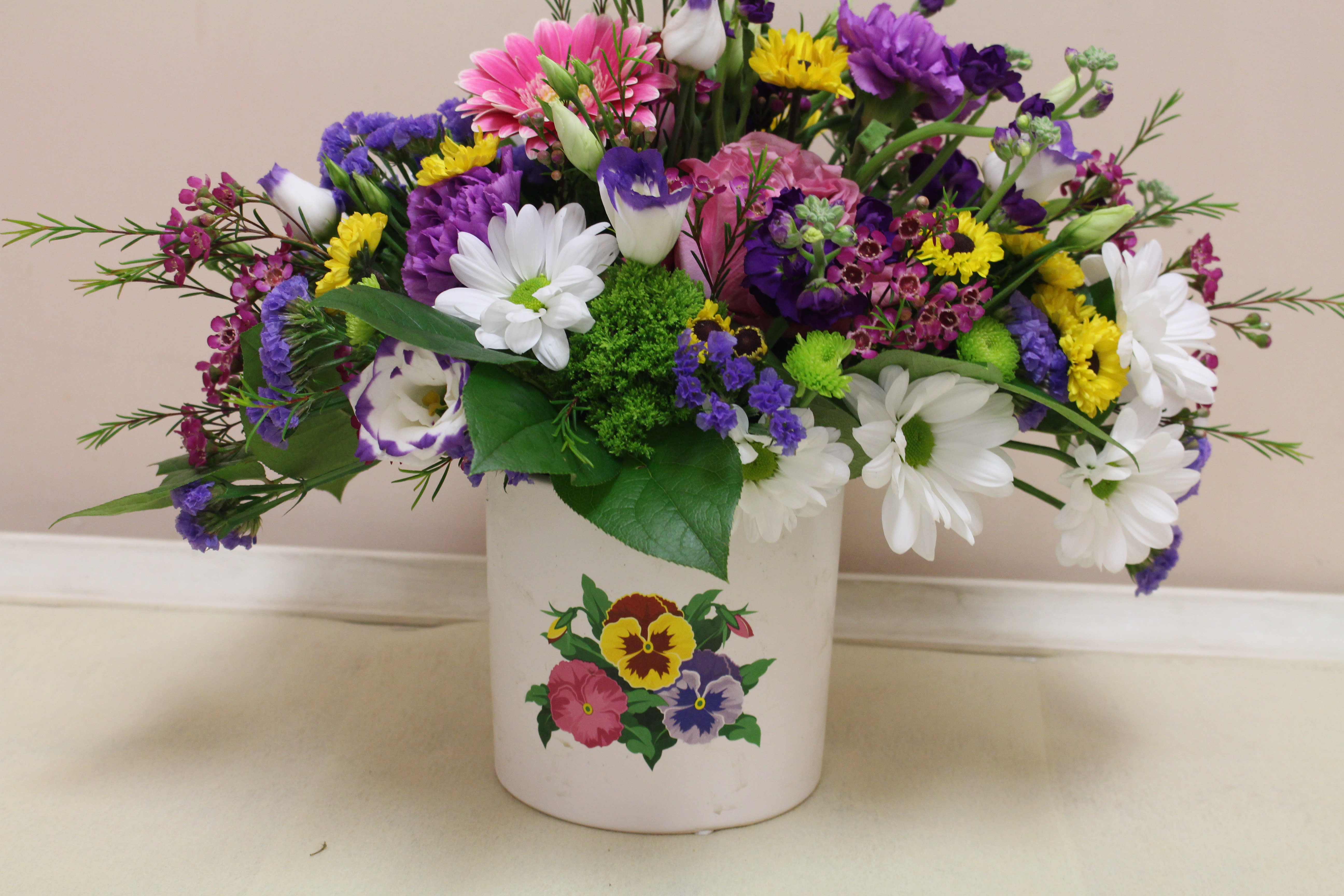 fields of pansy's   - spring arrangement in a pansy ceramic container 