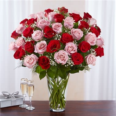 Ultimate Elegance ™ Long Stem Pink & Red Roses Ultimate Elegance ™ Long Stem Pink & Red Roses - Our radiant long stem roses are the ultimate romantic surprise. Four dozen blooms in charming pink & classic red are artistically arranged by our expert florists inside an elegant glass vase and personally hand-delivered to help you express how you feel in a beautiful way. All-around arrangement with 48 long stem pink & red roses; accented with baby’s breath and assorted greenery Our florists select the freshest flowers available, so shade of rose may vary due to local availability Artistically arranged in a classic clear glass vase 48-stem arrangement measures approximately 23"H x 18"L 36-stem arrangement measures approximately 23"H x 18"L 24-stem arrangement measures approximately 23"H x 18"L