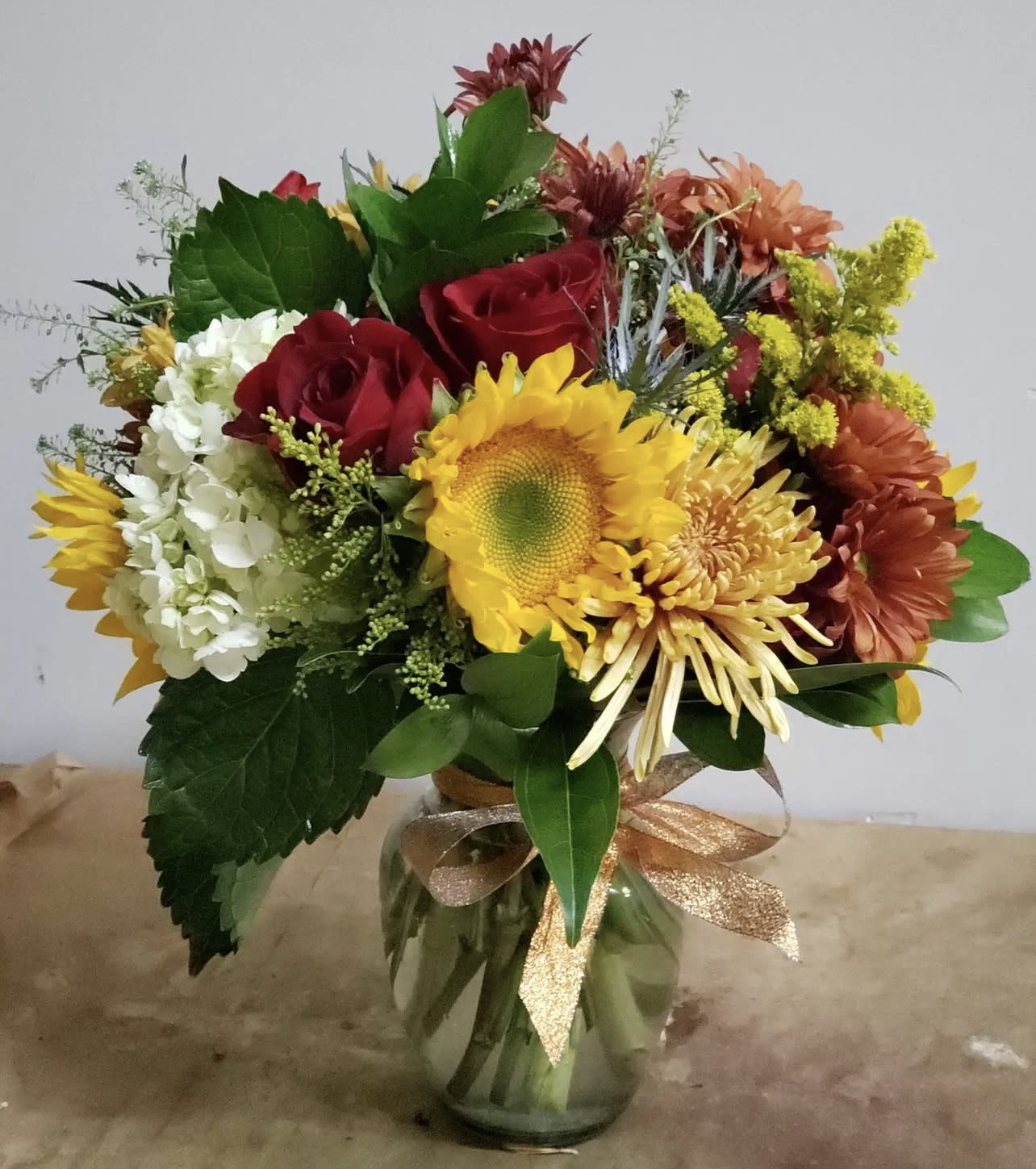 &quot;AUTUMN&quot; BOUQET VASE ARRANGEMENT - DESIGNER CHOICE of Fresh Cut Seasonal Fall/Autumn Florals placed in a clear vase with straw bow.  