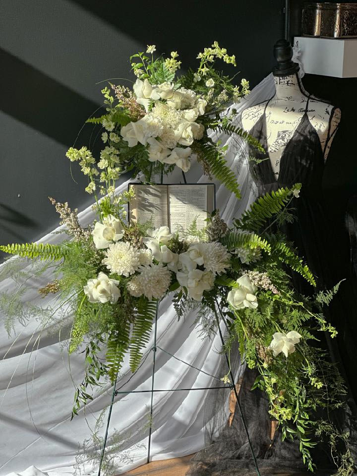 The Good Book - Meaningful scripture can be seen, surrounded with roses and soft foliage.