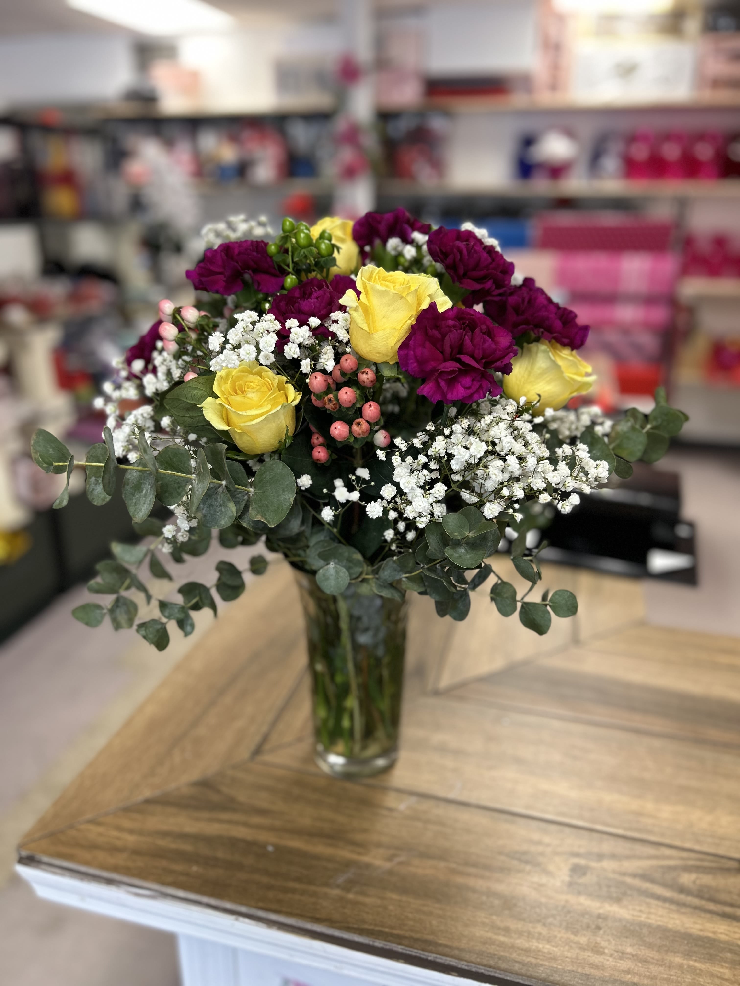 Assorted bouquet  - Assorted bouquet in glass base (carnations, roses, roses, and green leaves ) 