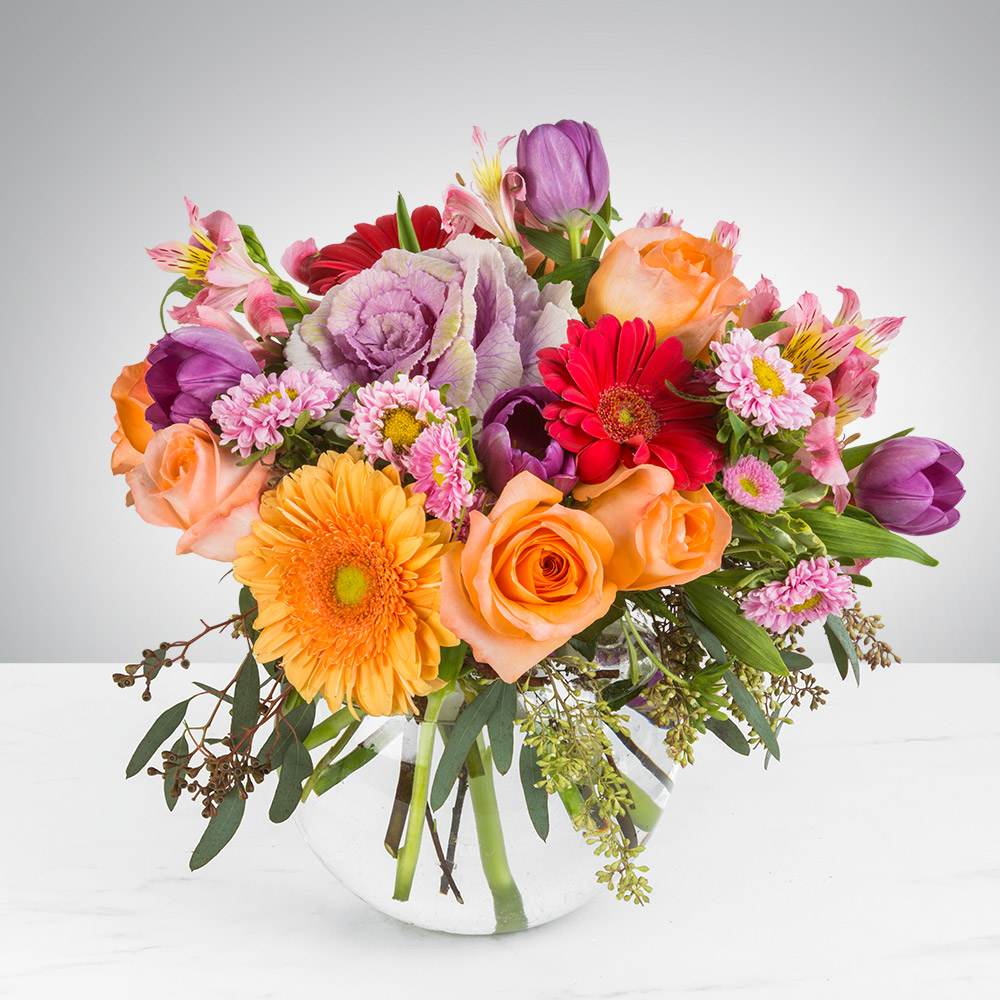 In My Garden by BloomNation™ In My Garden by BloomNation™ - This garden style arrangement includes gerbera daisies, roses, tulips, alstroemeria, and seasonal blooms. This is a great gift for a birthday or Mother's Day. APPROXIMATE DIMENSIONS: 12" D x 12" H