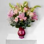Pink Perfectio n Pink Perfectio n - This soft display of pink carnations, alstromeria, and purple roses with a touch of white stock is a delicate way to send flowers for an illness, thank you, baby girl congratulations or just because.