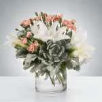 Poise by BloomNation™ Poise by BloomNation™ - A lovely succulent arrangement featuring blush and white flowers, Poise by BloomNation™ makes a great gift for almost any occasion like Best Friends Day or Sister's Day. Approximate Dimensions: 12"D x 12"H