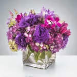 Royalty by BloomNation™ Royalty by BloomNation™ - This monochromatic purple arrangement is perfect for any event ranging from a housewarming gift to a friend to a birthday surprise! Send it to somebody who deserves to be treated royally. Approximate Dimensions: 10"D x 10"H