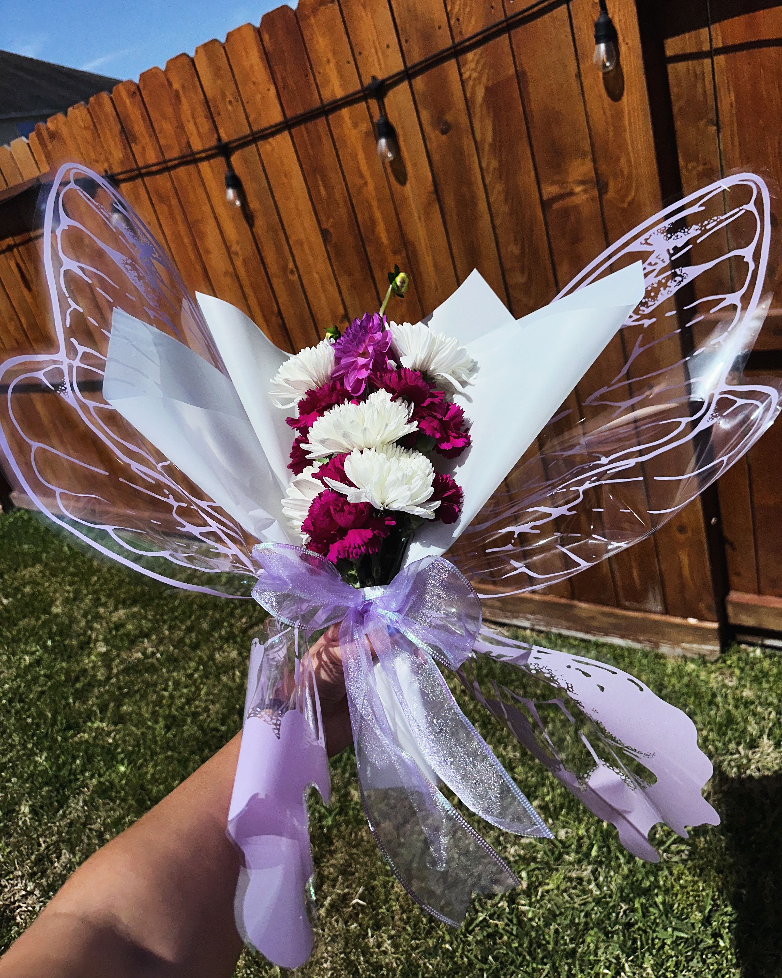 Butterfly Bliss Butterfly Bliss - This arrangement is is a mixture of art and floristry. Just as butterflies undergo metamorphosis, flowers bloom and fade, reminding us of the cycles of growth and change.