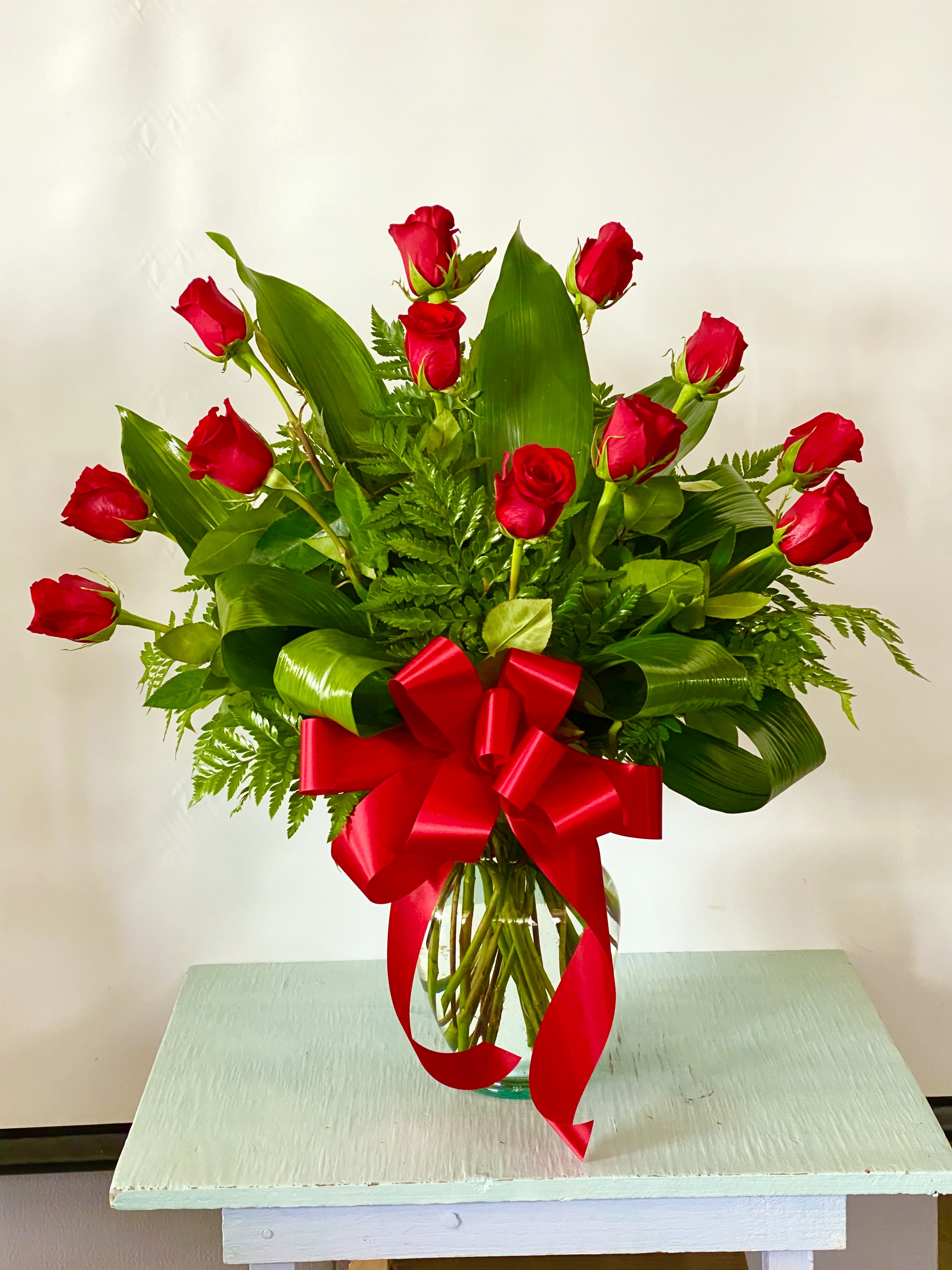 Anniversary #6 Anniversary #6 - An arrangement of all roses designed in a clear glass vase. Arrangement includes a bow. The color on both the roses and the bow can be modified as long as the color is in stock. Also colors can be mixed. Arrangement does not necessarily need to be one color.