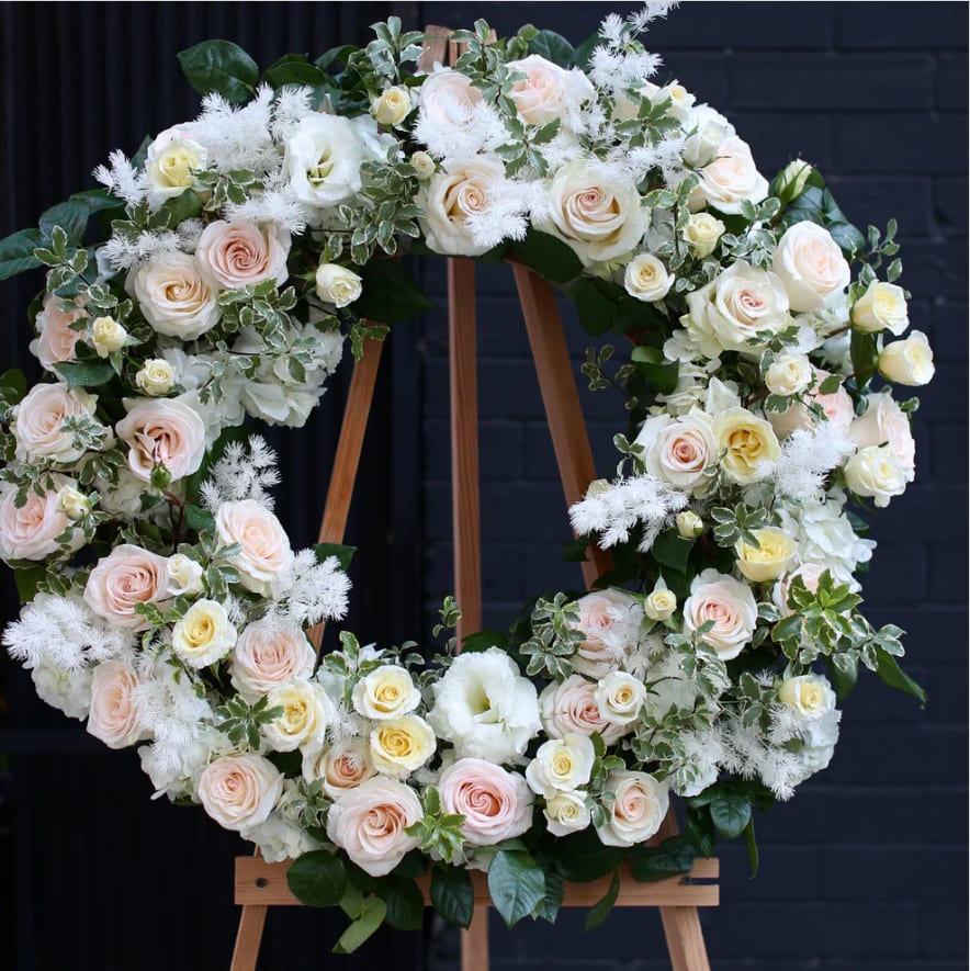 Loving Tribute - A beautiful blend of white and beige roses, this sympathy spray offers a serene and respectful tribute. Ideal for honoring loved ones, it brings comfort and elegance to memorials and funerals.