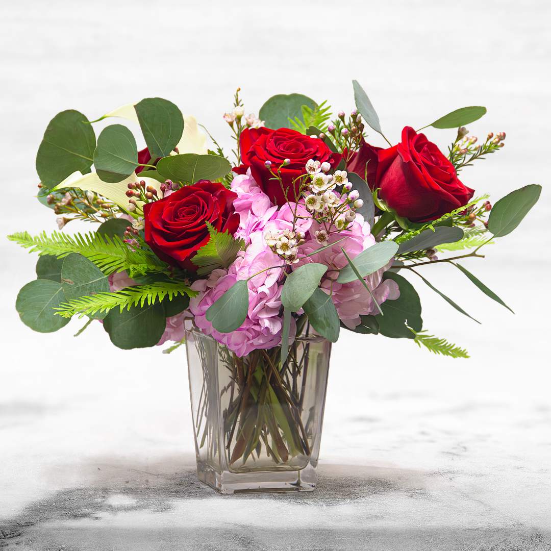 Valli in love  - This rose combination is flirty, yet romantic. Made with Roses, Hydrangeas and Eucalyptus.   Valli in love comes with a pot . APPROXIMATE DIMENSIONS 4&quot; W X 6&quot; H