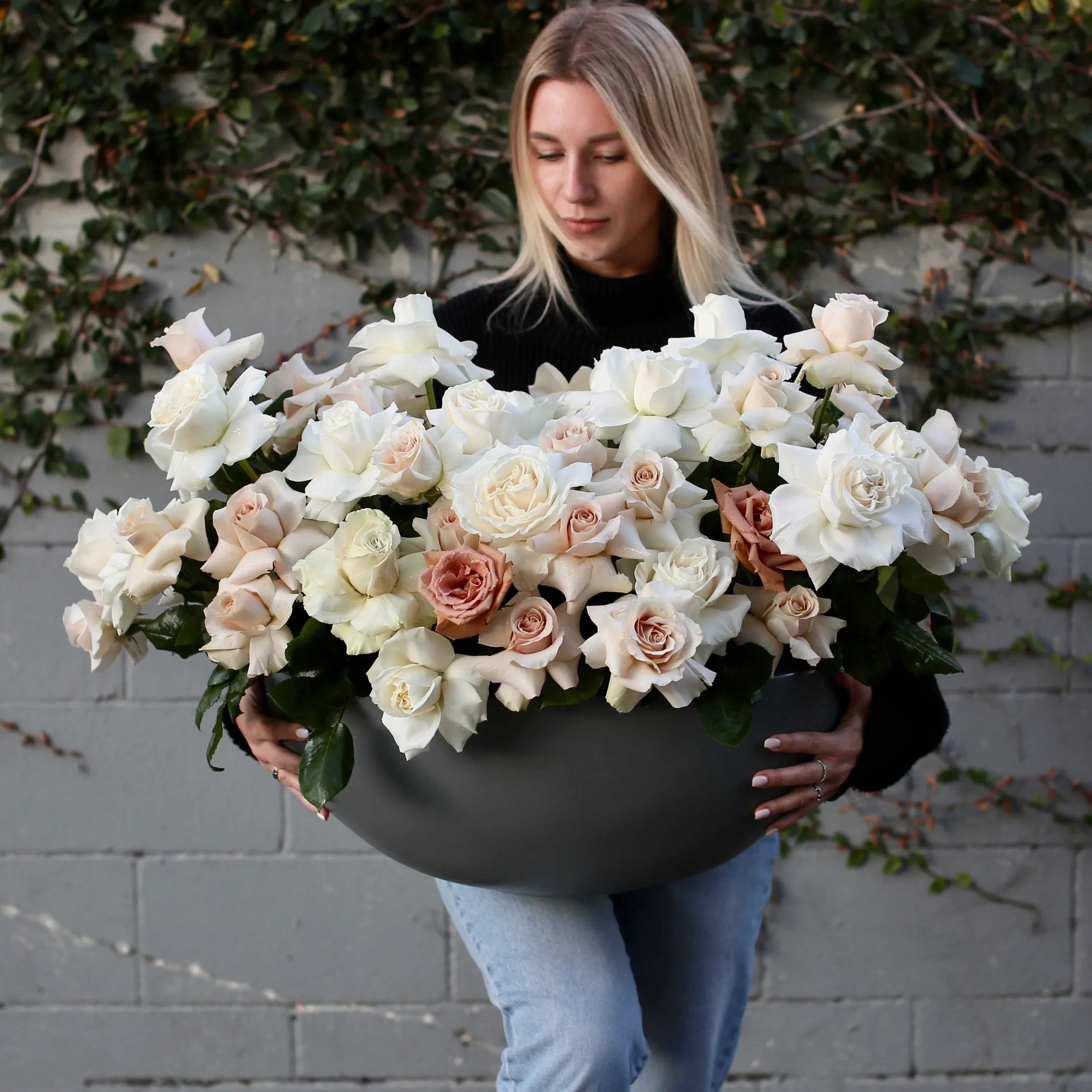 Majestic - White and beige roses elegantly arranged in a vase, a serene and sophisticated choice for any occasion.