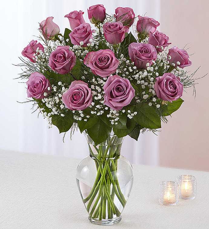 Roses 18 lav - 18 lavender roses in a vase with baby's breath  #spring  #Valentine'sDay  #Romance  #love  #roses  #valentinesday   #Samedaydelivery    Since ancient times, special meaning has been attributed to different colors and species of flowers. Roses have always represented love, in general, but the specific significance changes with the colors of the petal. If you want your gift of roses to carry with it an inherent message, you'll need to understand the meaning behind each color.  #NationalRosemonth  #Rosesale  #sale  #summer  #fathersday  #july4th  #red