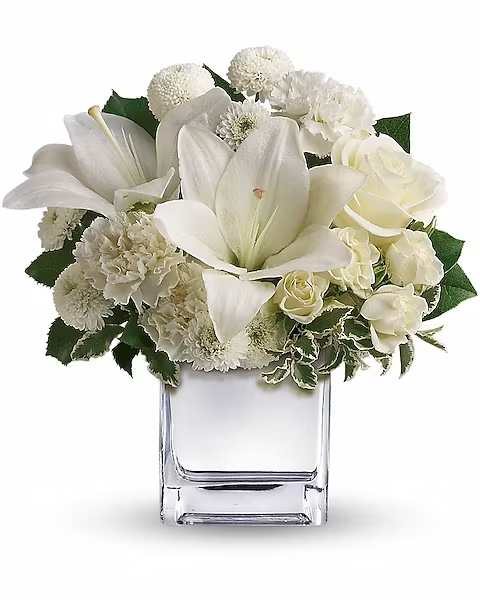 Peace &amp; Joy Bouquet - The price is nice, and the bouquet is spectacular! Snowy-white roses, lilies, carnations and mums artistically arranged in a dazzling silver cube.  The lovely bouquet includes white roses, white spray roses, white Asiatic lilies, white carnations and white button spray chrysanthemums accented with assorted greenery.  