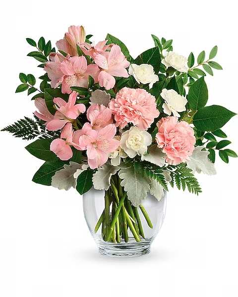  Whisper Soft Bouquet - Its blooms may be whisper-soft, but this bouquet proclaims your love loud and proud! What a lovely way to spoil someone special. This delicate arrangement includes pink alstroemeria, pink carnations, white miniature carnations, dusty miller, huckleberry, leatherleaf fern, and lemon leaf. Delivered in a Clear Glass Ginger Jar.