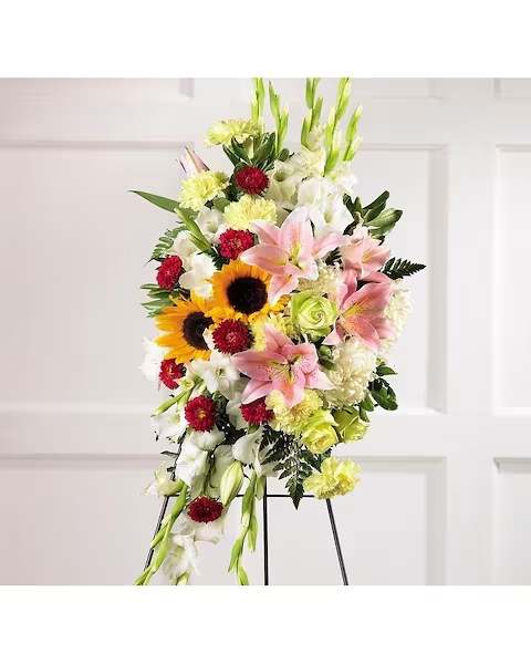 Fondest Memories Fondest Memories - Sunflowers nestled among fragrant Asiatic Lilies, Gladioli, Carnations, Roses and more are elegantly arranged in this beautiful standing spray. Arrangement is delivered on an easel and is appropriate to send to a funeral home or service.