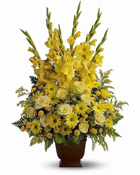 Sunny Memories Sunny Memories - Honor a bright spirit who was like a ray of sunshine to everyone they encountered, with a grand display of bold yellow blossoms. At more than three feet tall, it will add a touch of brightness to any tribute. A mix of fresh yellow flowers such as roses, gladioli and chrysanthemums - accented with fern - is delivered in a Noble Heritage urn.