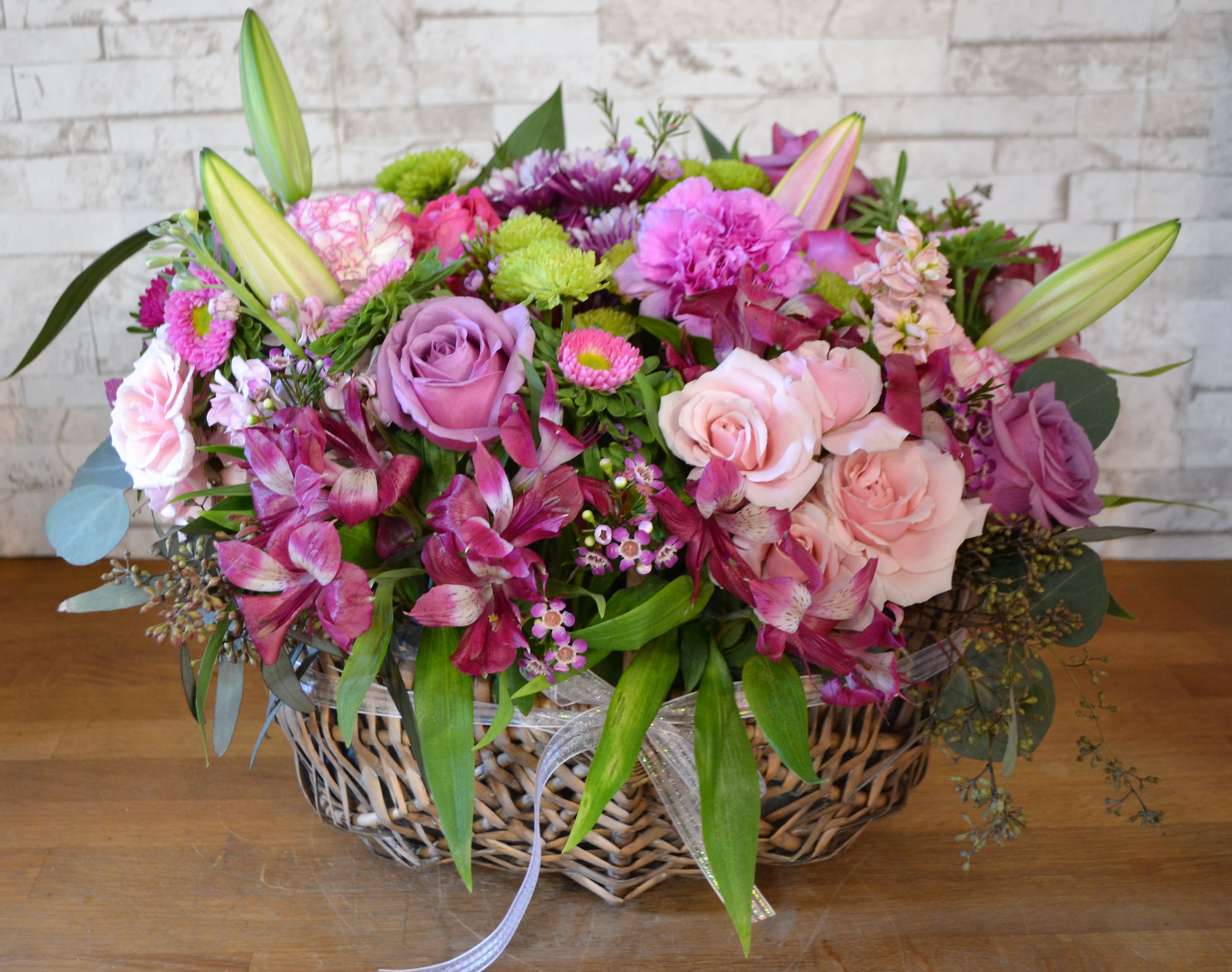 Loving Out Loud Loving Out Loud - An out loud expression of Love, an extravagant display of colors and scents, a beautiful combination of Roses, Astar, Chrysanthemum and additional flowers, arranged in a natural wicker basket.
