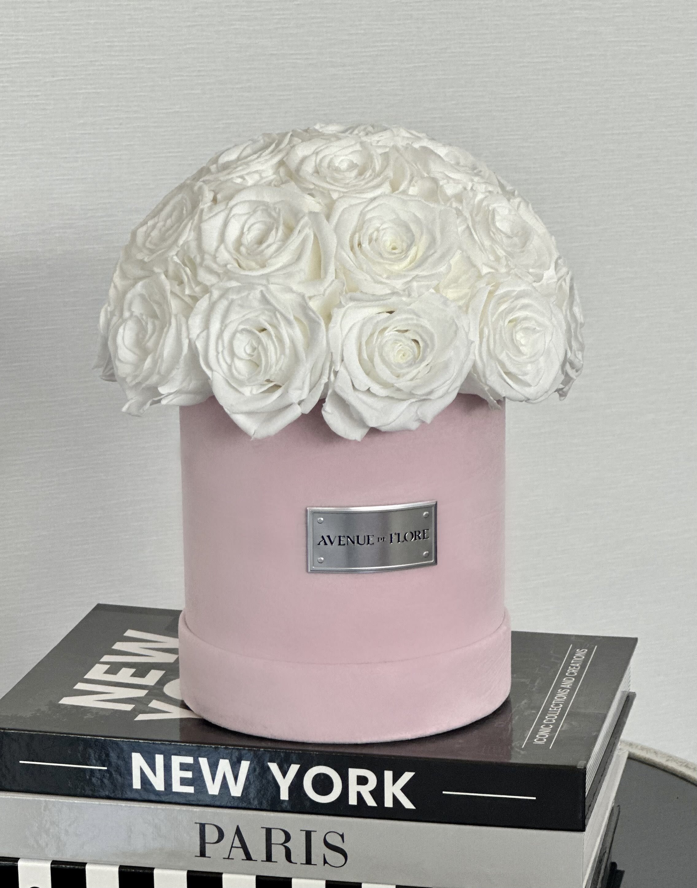 Pink Velvet Box - White Preserved Roses - Introducing our exquisite Soft Suede Velvet Pink Box of over 25 White Eternal Roses—a luxurious testament to timeless beauty and enduring love. Nestled in a gently textured pink suede box, each pristine white rose is meticulously preserved to last for a year, offering a perpetual reminder of elegance and grace. 