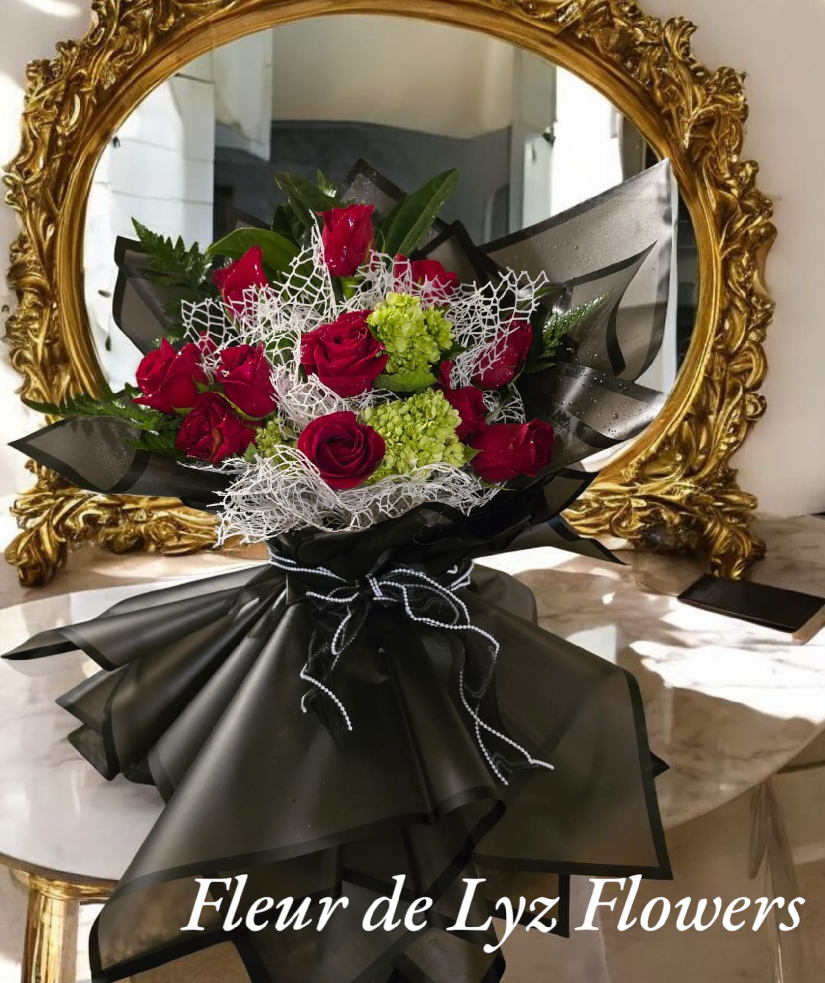 Loved and adored bouquet Loved and adored bouquet - A beautiful bouquet wrapped in black Korean paper designed with a dozen red roses and three green hydraengeas
